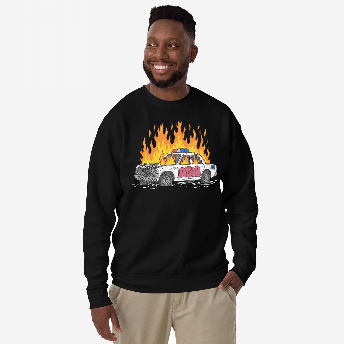 ACAB Police Car Hoodie & Sweatshirt features a bold design with a cartoon wrecked police cruiser in flames, tagged with graffiti, embodying rebellious, punk energy and visible resistance.