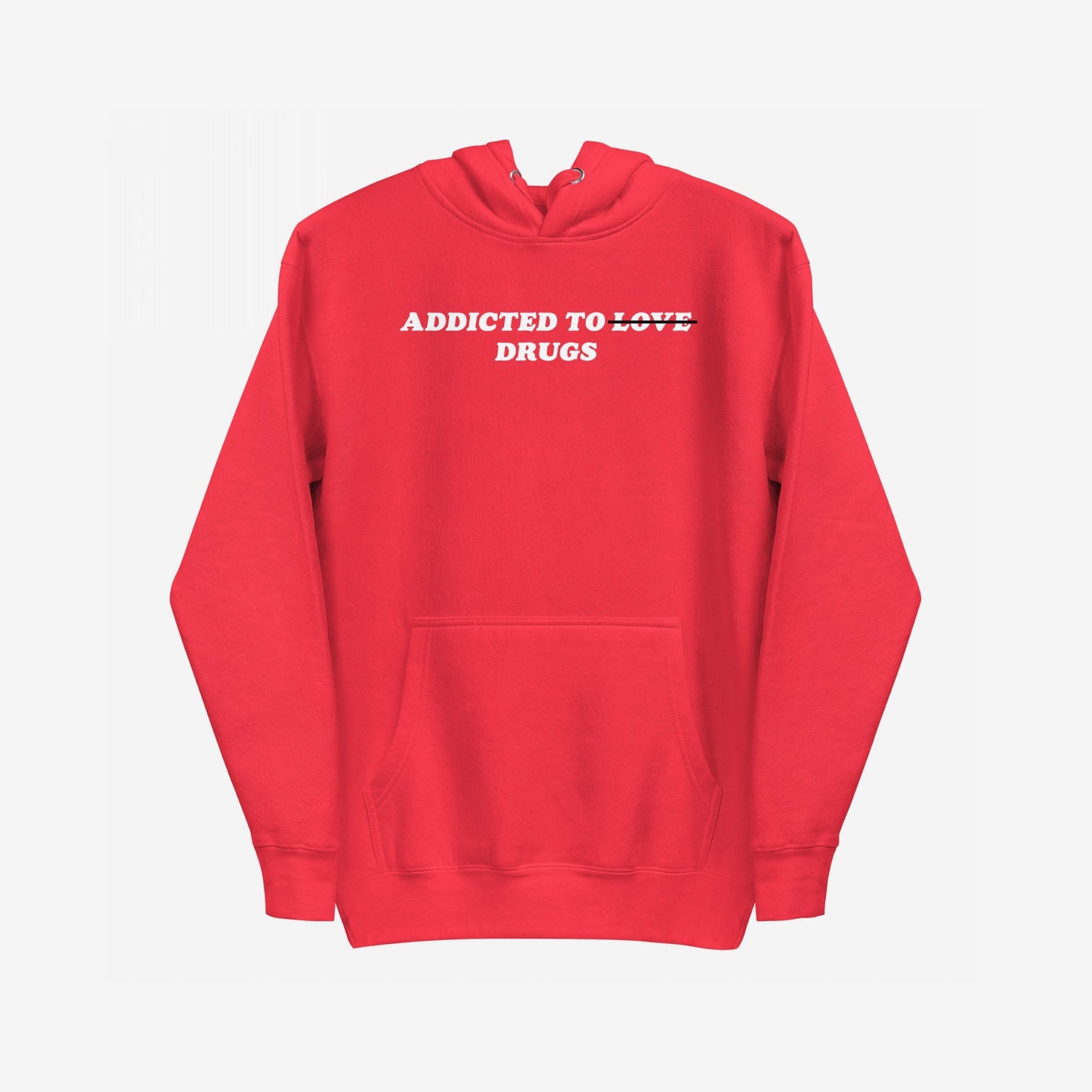 Red pullover hoodie titled Addicted To Love / Drugs features white block letters with “LOVE” crossed out and “DRUGS” underneath, symbolizing raw personal struggle and self-awareness. Front kangaroo pocket.