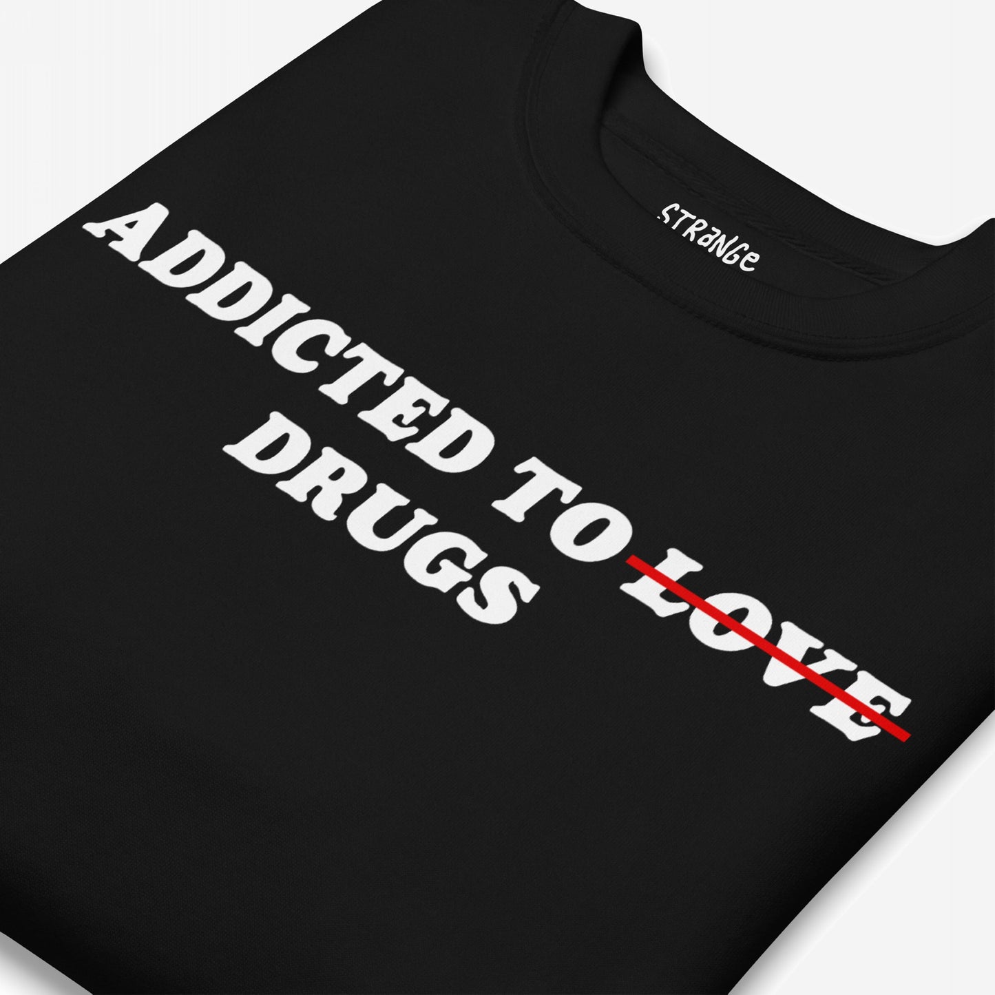 Addicted To Love / Drugs Hoodie & Sweatshirt: Black T-shirt with 'ADDICTED TO LOVE' slogan, 'LOVE' crossed out, replaced with 'DRUGS', inside collar shows brand name, symbolizing personal struggle and self-awareness.