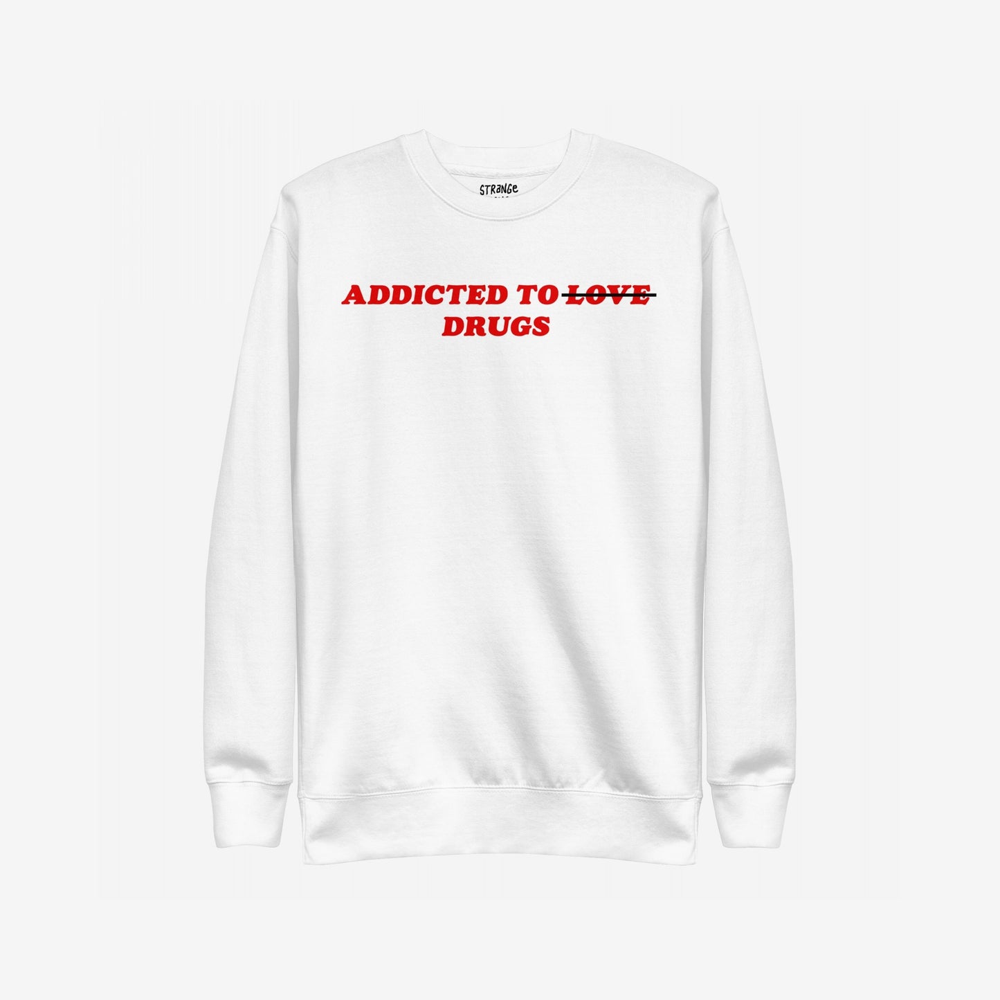 Addicted To Love / Drugs Hoodie & Sweatshirt features bold red text crossing out LOVE for DRUGS on a white sweatshirt, embodying personal struggle and self-awareness. Branding label inside reads “STRANGE.”