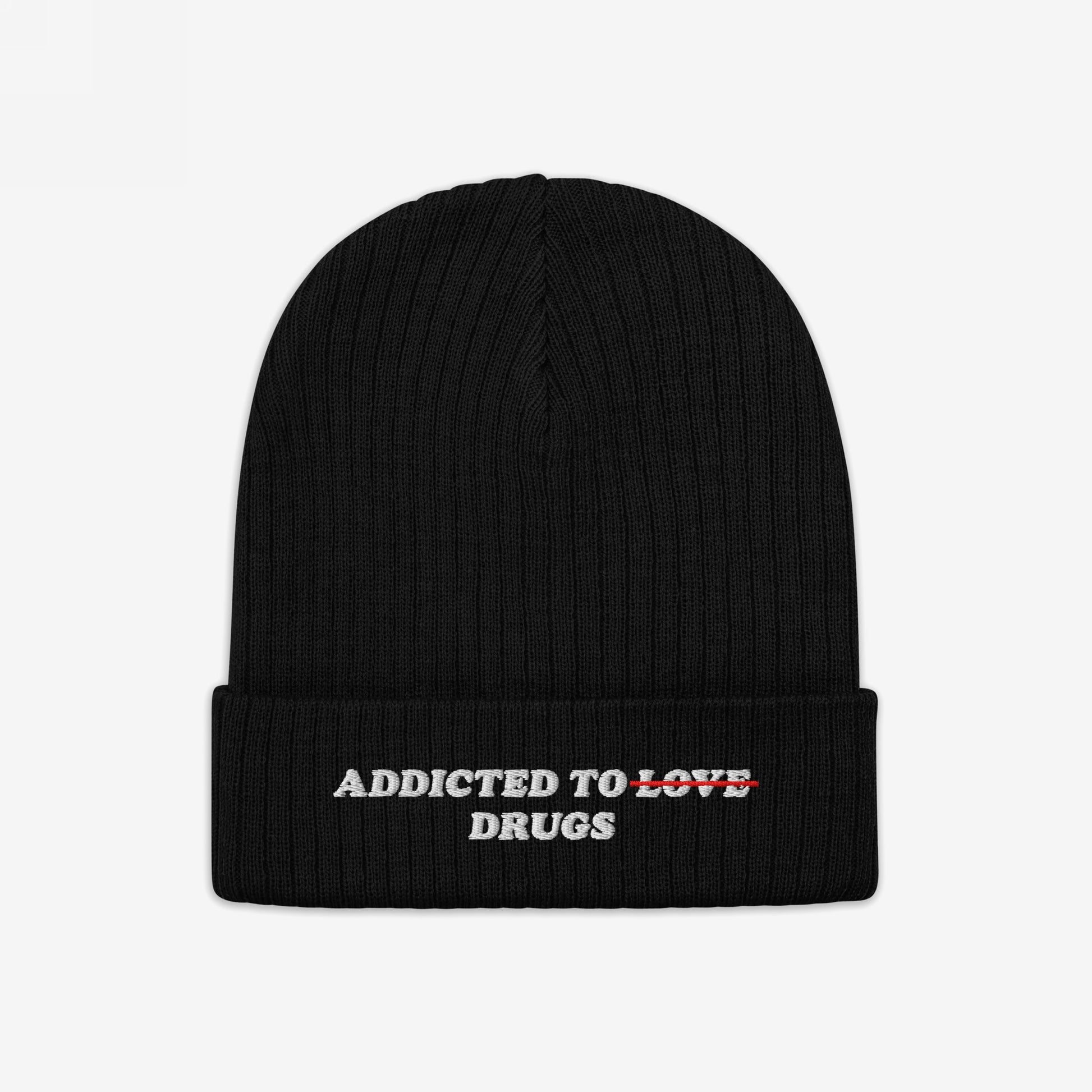 Black knit beanie featuring embroidered bold text "Addicted To Love" crossed out and replaced with "Drugs" from the Addicted To Love / Drugs Hat collection.