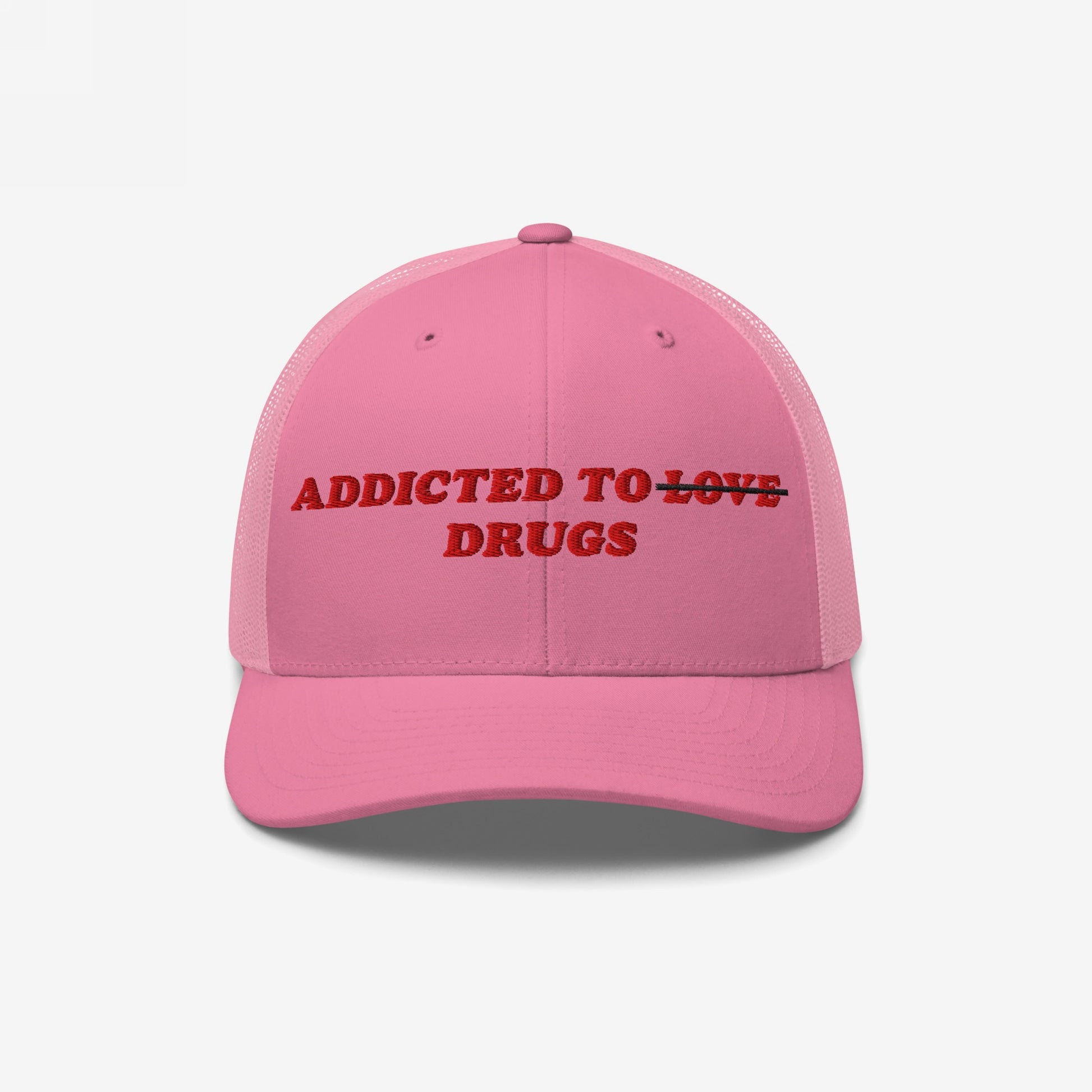 Pink snapback hat with embroidered text "Addicted To Love" crossed out and replaced by "Drugs" from the Addicted To Love / Drugs Hat collection.