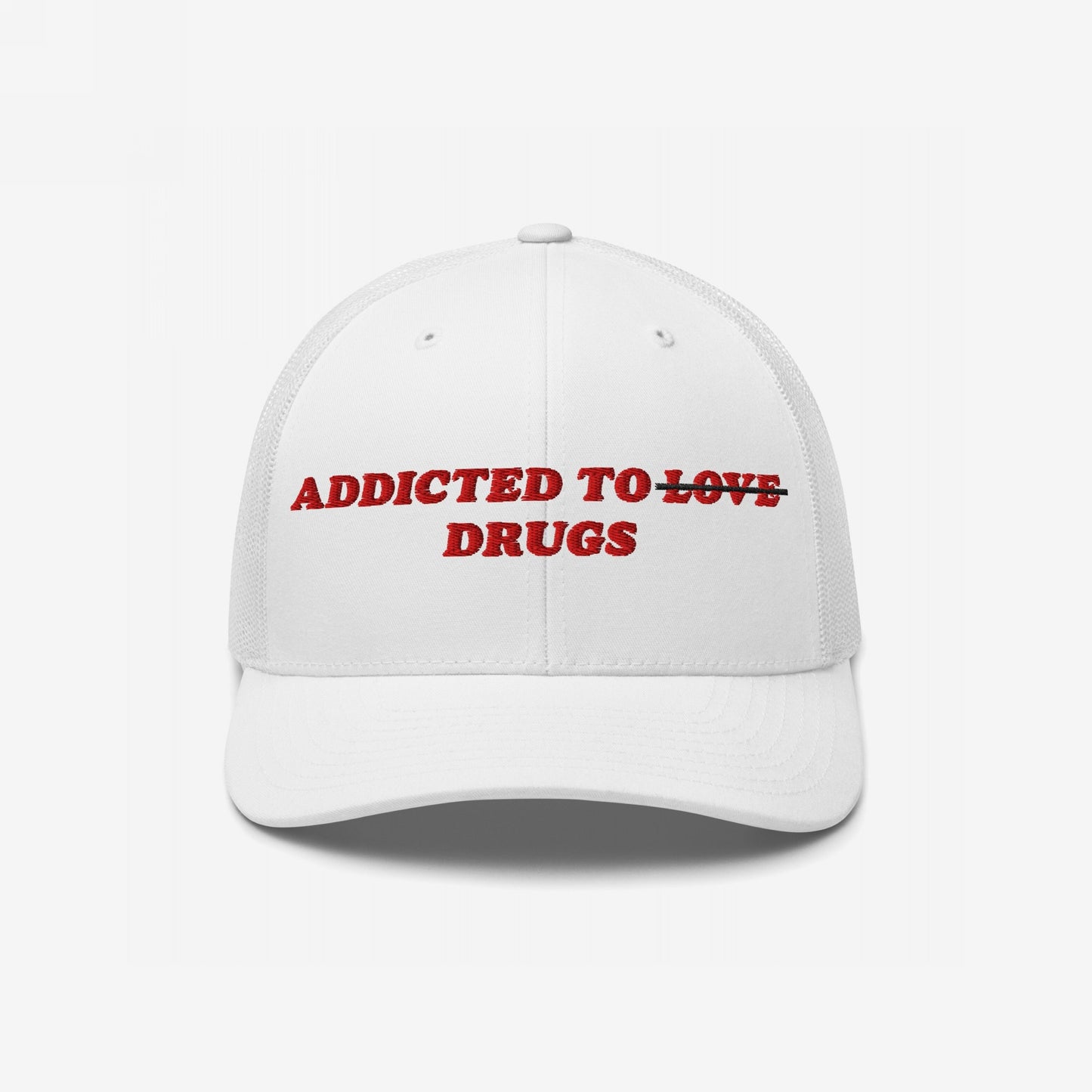 White trucker-style cap with red embroidery, reading ADDICTED TO with LOVE struck through and DRUGS below. The Adulting Sucks Hat conveys a candid, rebellious message for the overwhelmed.