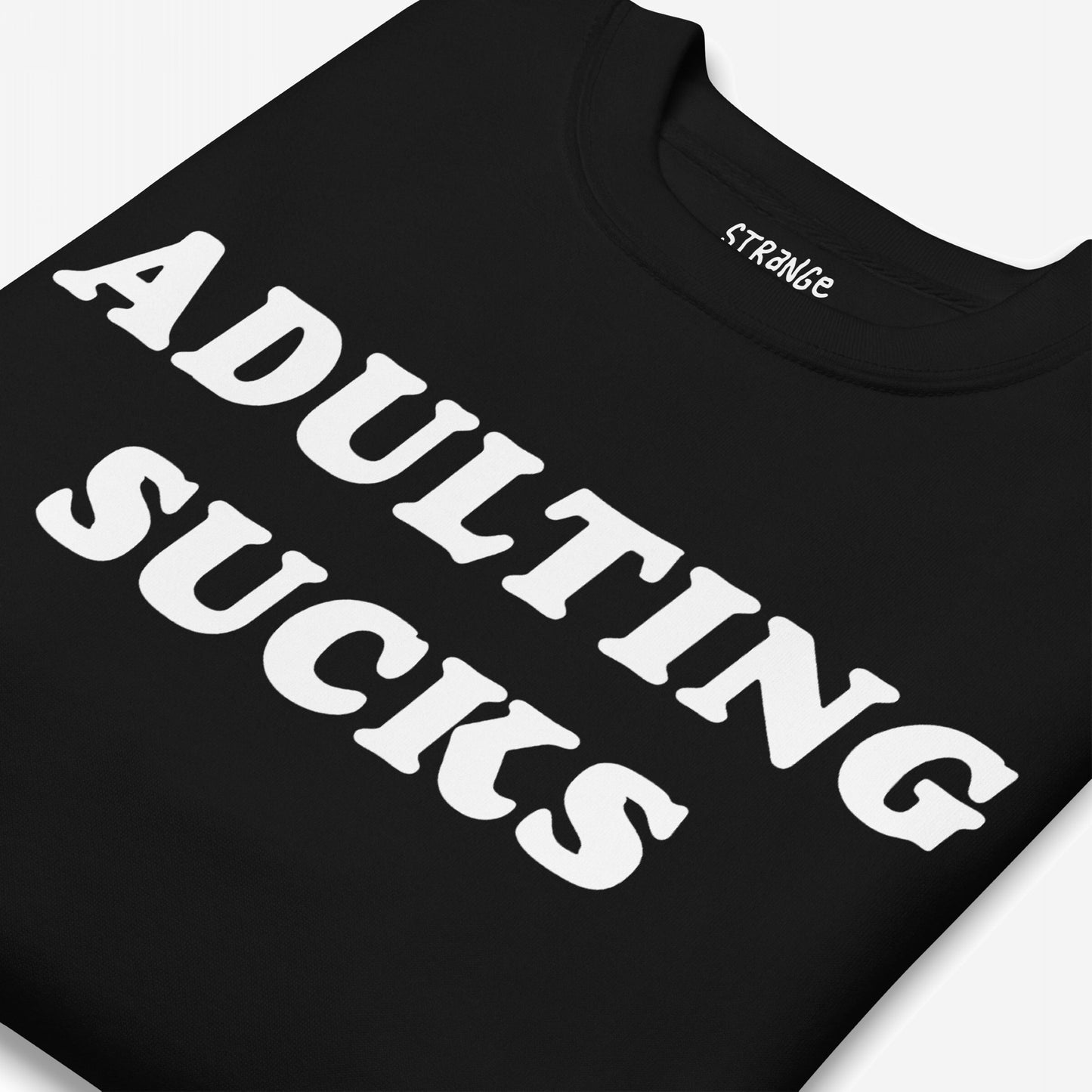 The Adulting Sucks Hoodie & Sweatshirt features bold white text on a black T-shirt, humorously expressing the challenges of adulthood. Perfect for adding a relatable touch to your everyday wardrobe.