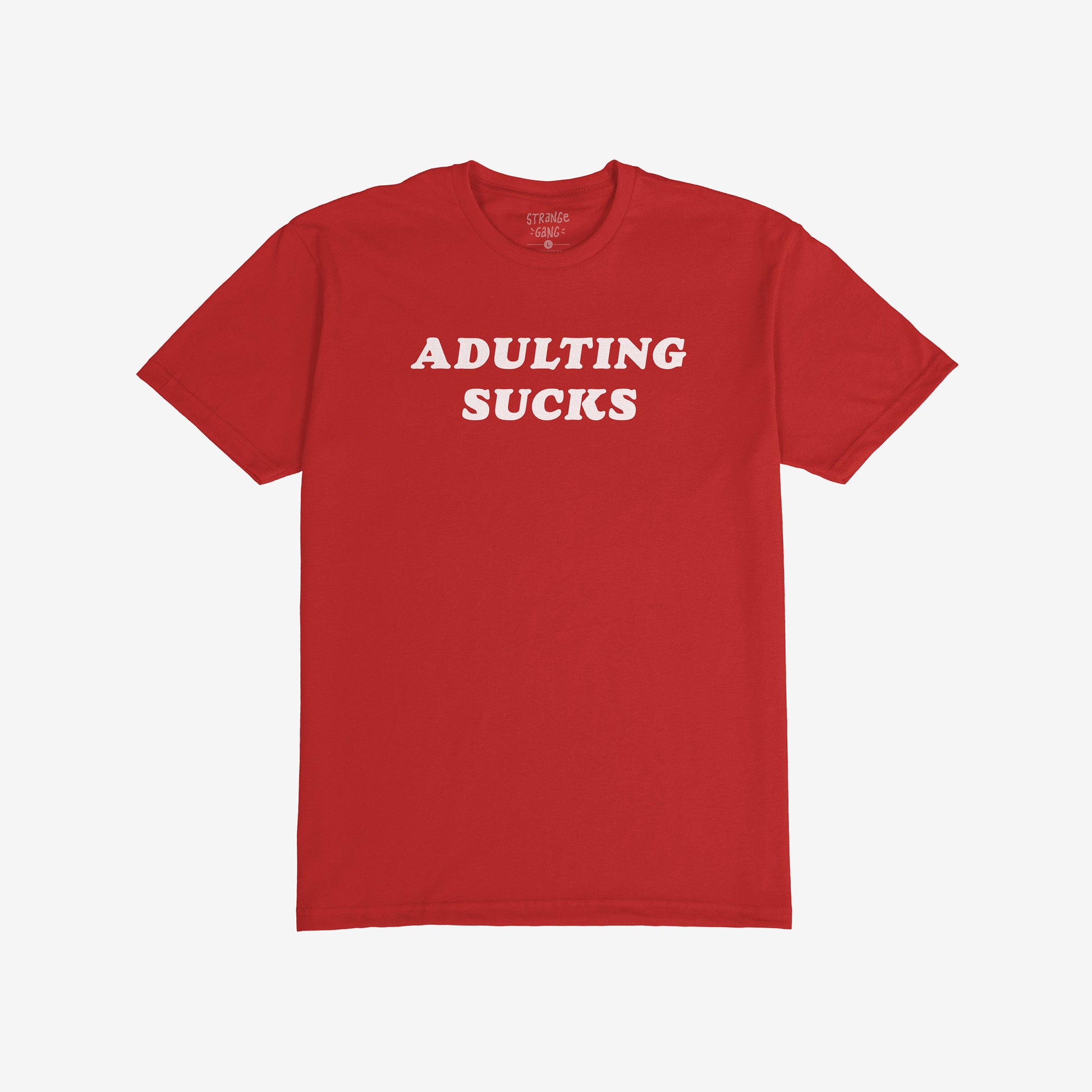 A red T-shirt with ADULTING SUCKS in bold white letters, reflecting humor and self-expression; part of a collection supporting equality and mental health awareness.