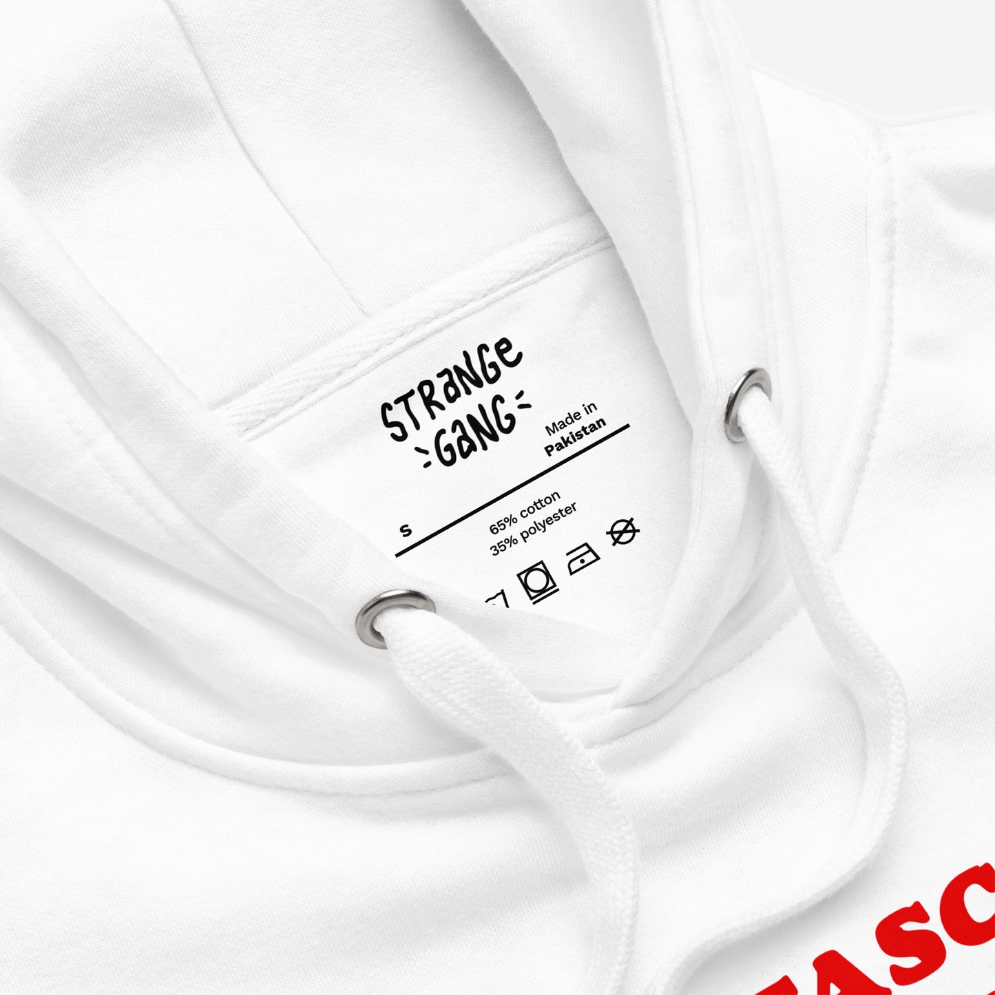 Close-up of the Anti-Fascism Is Self-Defense Hoodie & Sweatshirt, featuring a label with Made in Pakistan, size S, and fabric details. Highlighting drawstrings and metal eyelets for a detailed view.