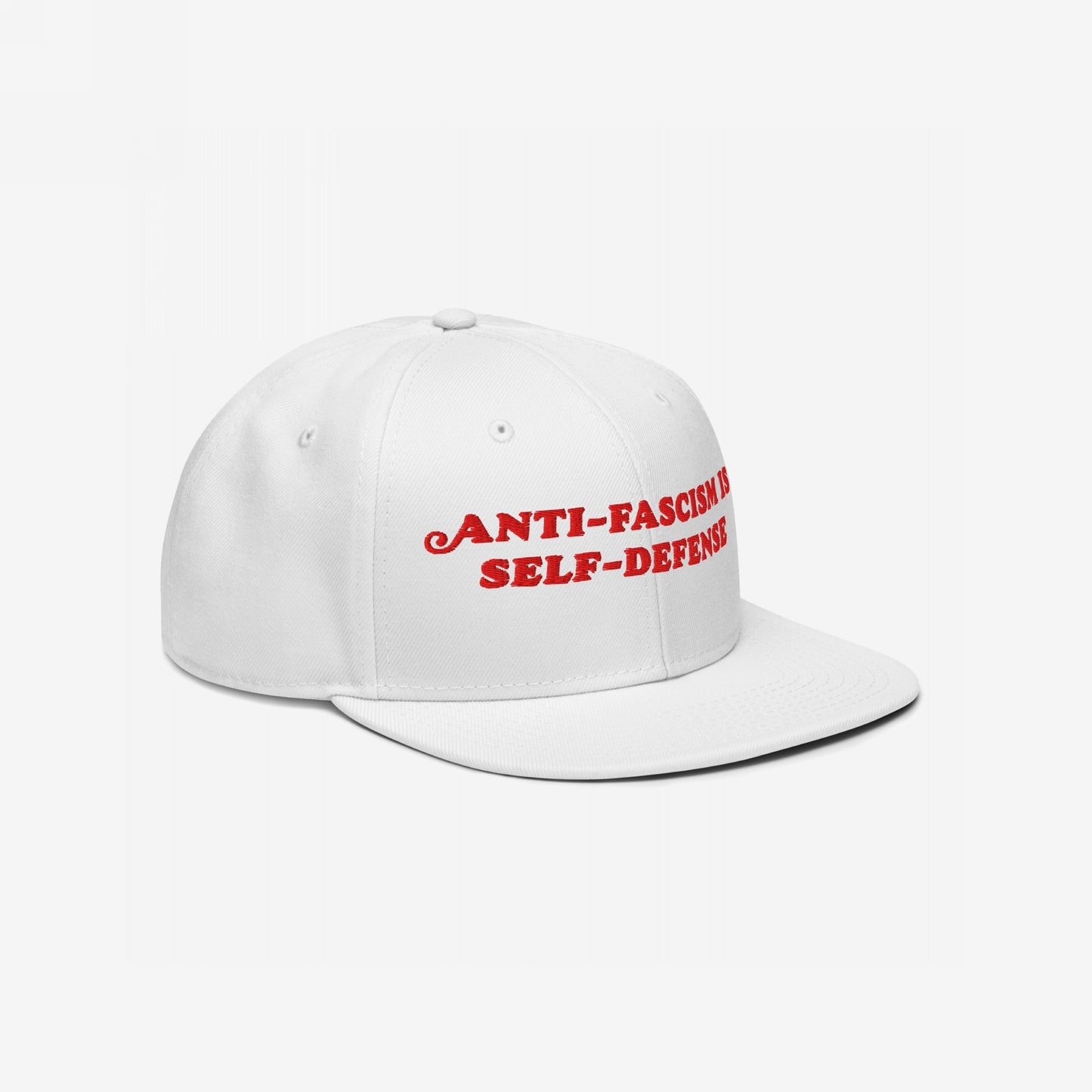 White flat-brim cap with “Anti-Fascism Is Self-Defense” in bold red embroidery, representing resistance and activism. Ideal for protests or daily wear, shipping from the EU, supporting Amnesty International.