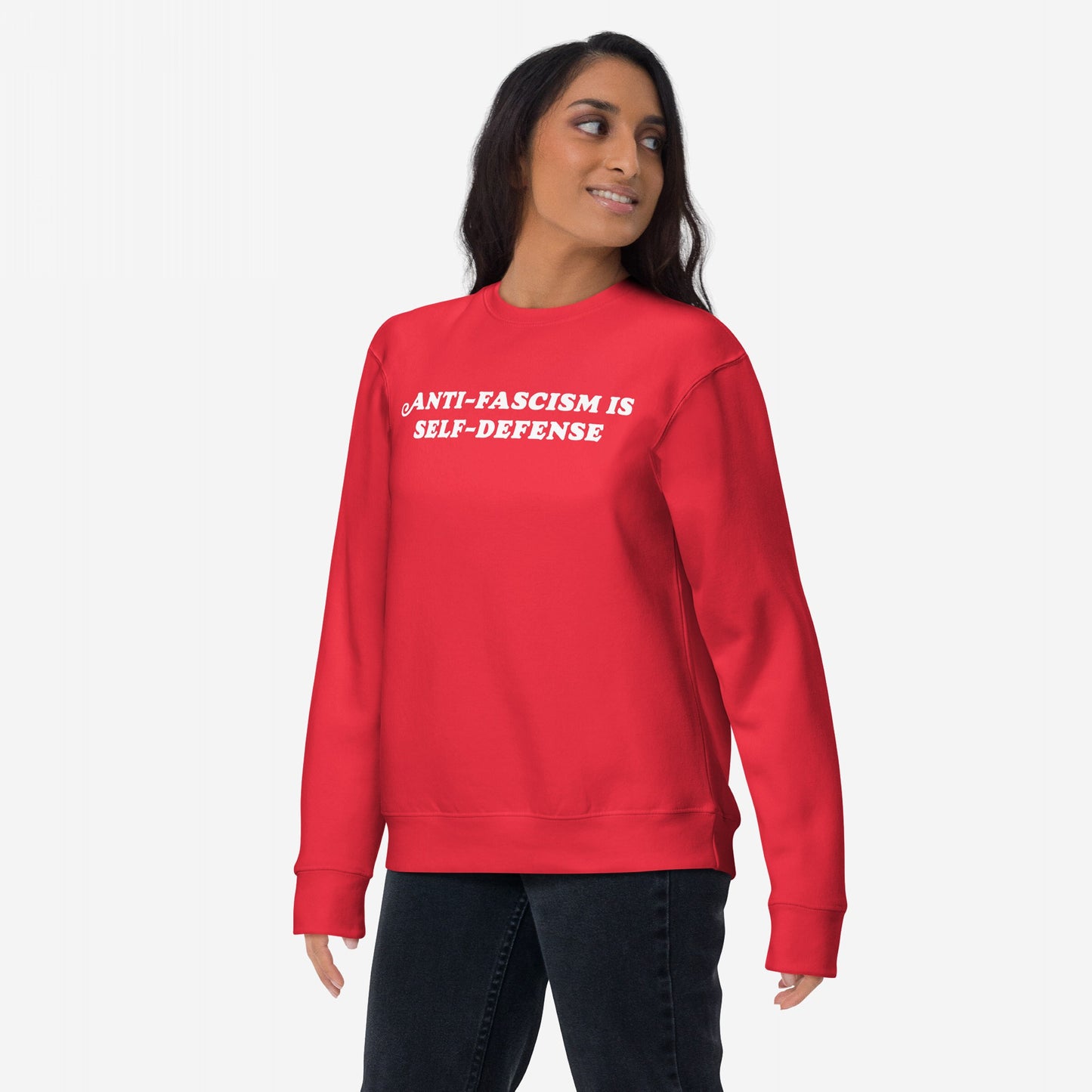 Young adult wearing the Anti-Fascism Is Self-Defense Hoodie & Sweatshirt, featuring bold white text on a red crewneck, embodying a message of resistance and equality.