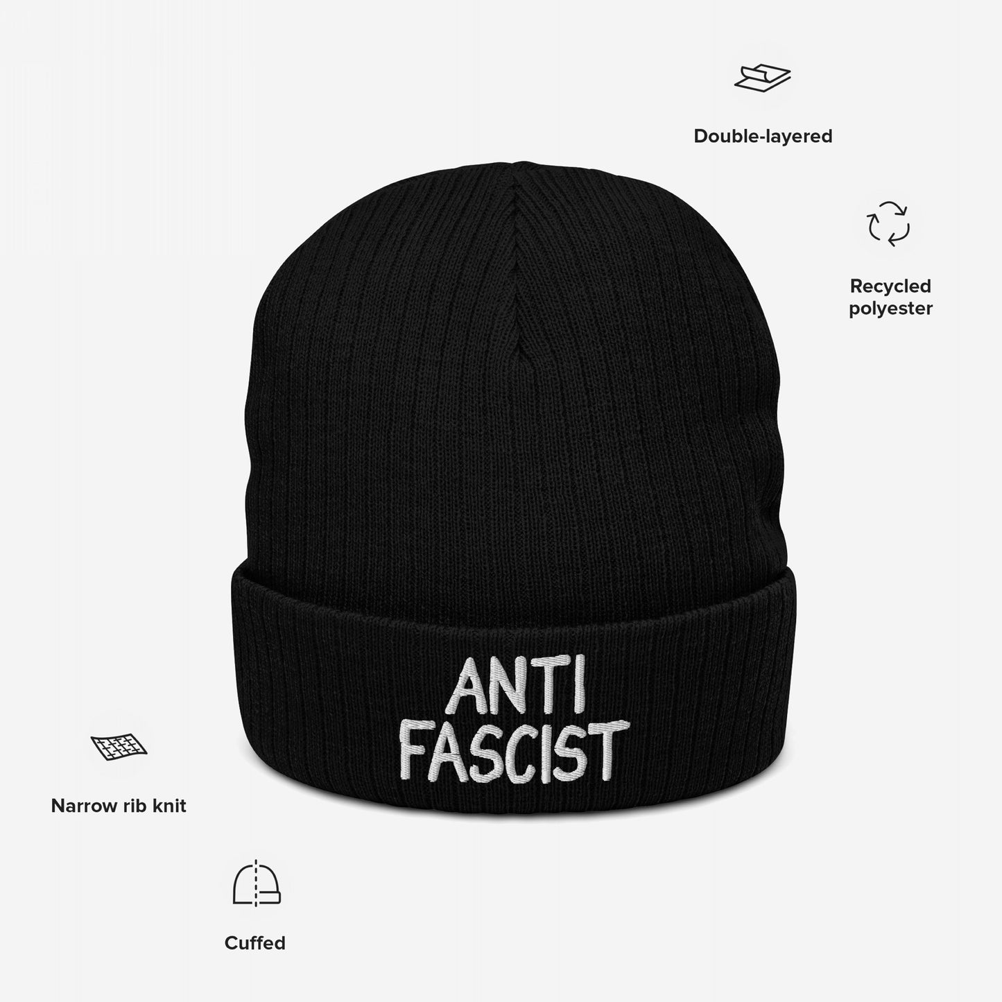 Black Anti-Fascist knit beanie hat with white embroidery on cuff. Features include double-layered recycled polyester, narrow rib stitch, and cuffed brim, reflecting ethical, gender-free design against fascism.