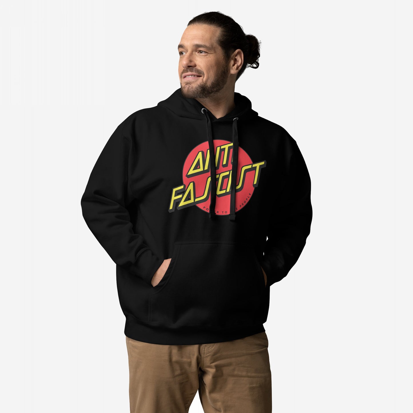 Anti-Fascist Hoodie & Sweatshirt featuring a red circle with bold yellow ANTI FASCIST lettering, worn by a man with hands in the pocket against a light background.