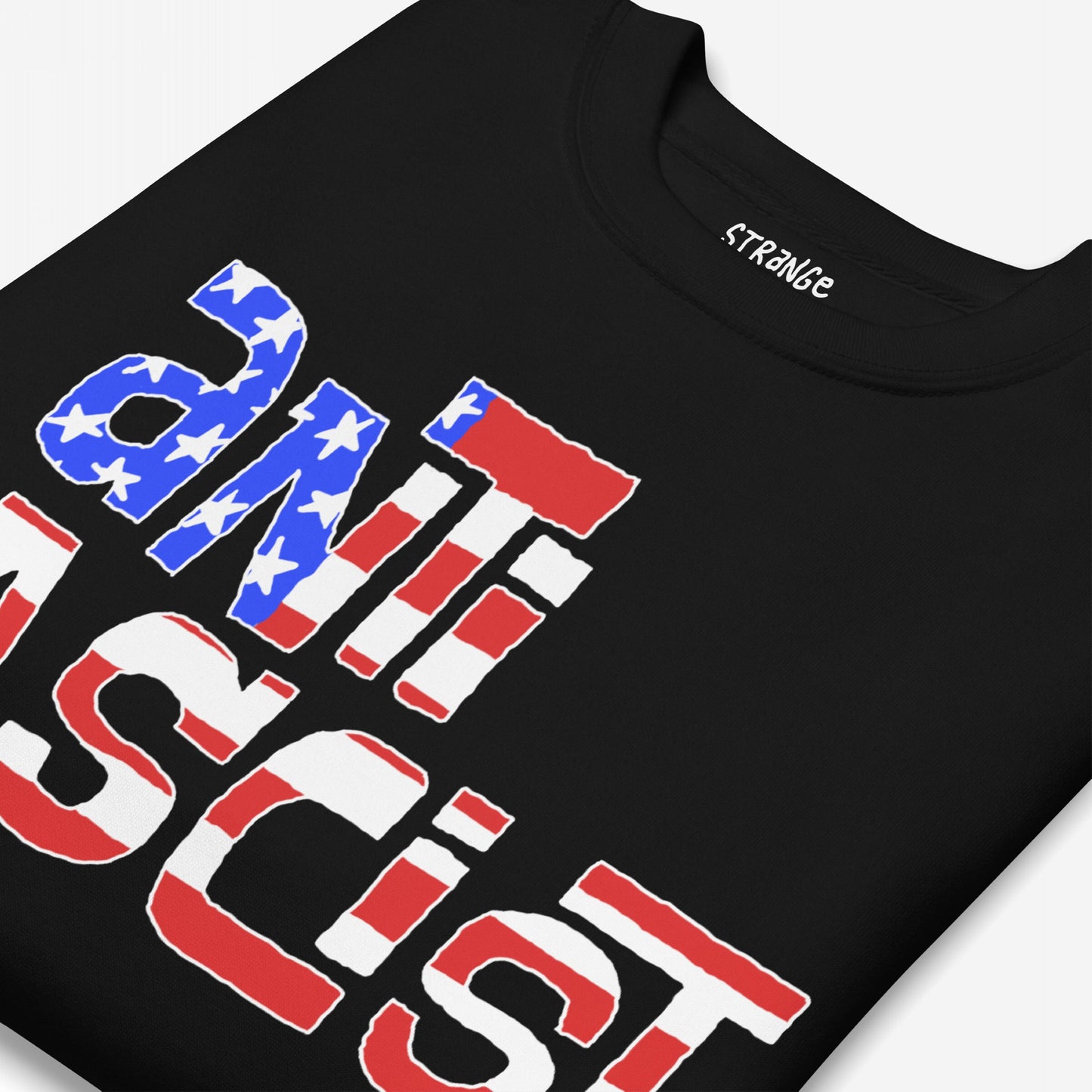Anti-Fascist USA Hoodie & Sweatshirt features a close-up of a folded black T-shirt with “ANTI FASCIST” in stars-and-stripes print, capturing a bold statement against hate and reclaiming patriotism.