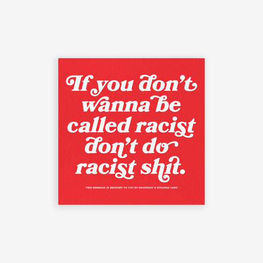 Anti-Racist Sticker & Magnet with bold message against racism, featuring white text on a red square over blurred city backdrop. Collaboration with Egoproof, designed for visible advocacy against injustice.
