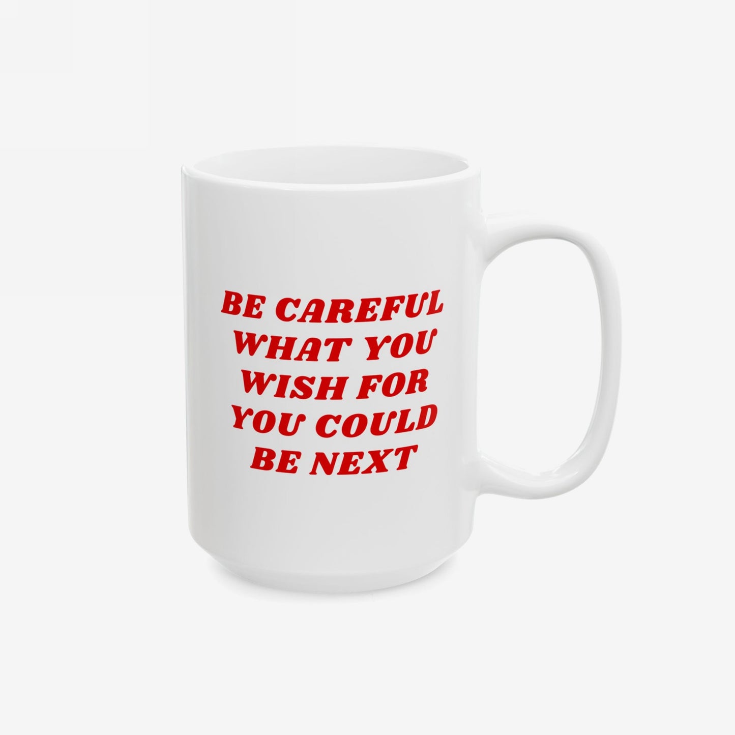 The Be Careful Mug features bold red text, BE CAREFUL WHAT YOU WISH FOR YOU COULD BE NEXT, on a white ceramic surface, highlighting progressive values with a stark message.