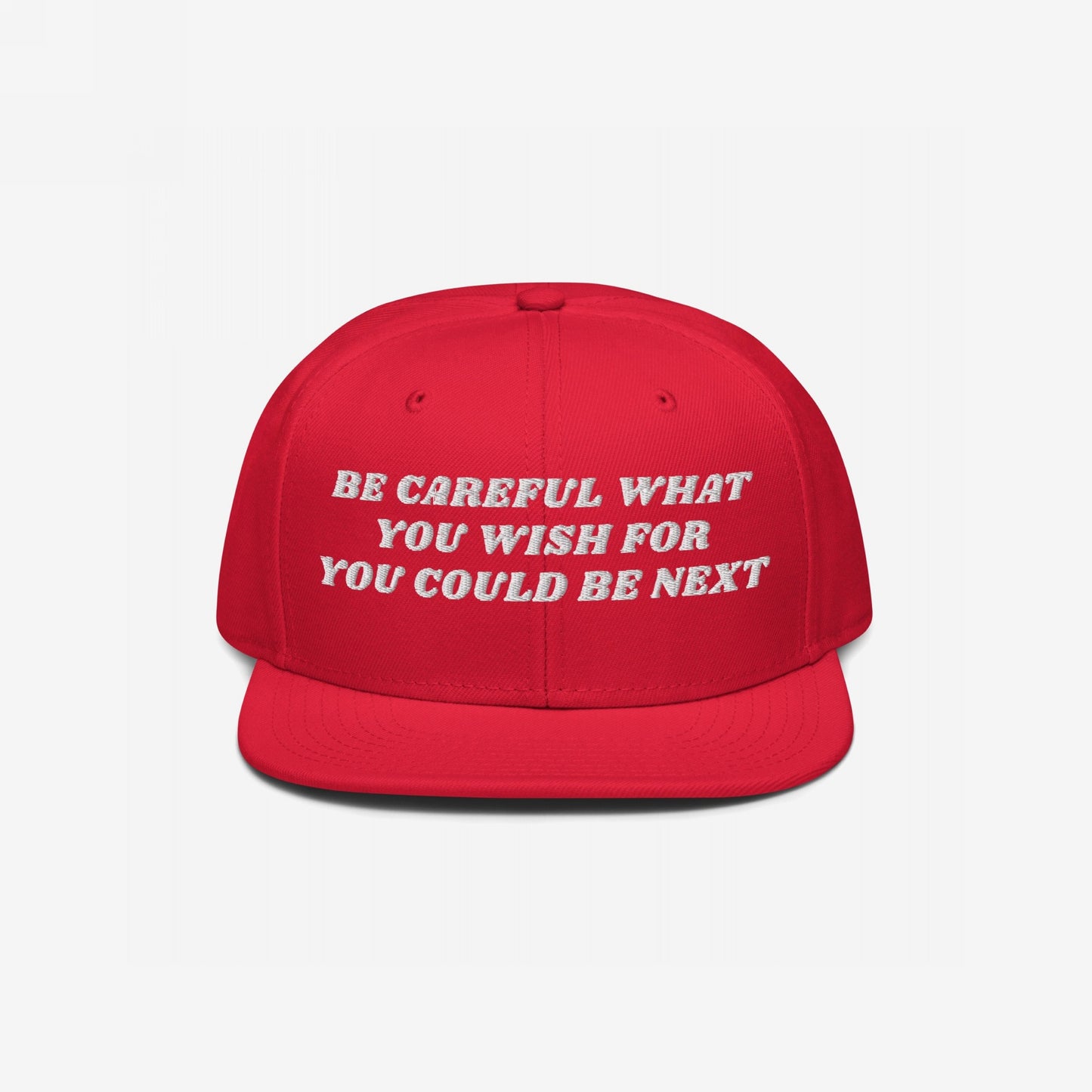 The Be Careful Hat features bold white embroidery with the phrase BE CAREFUL WHAT YOU WISH FOR YOU COULD BE NEXT on a flat-brim snapback, embodying a strong, stylish statement.
