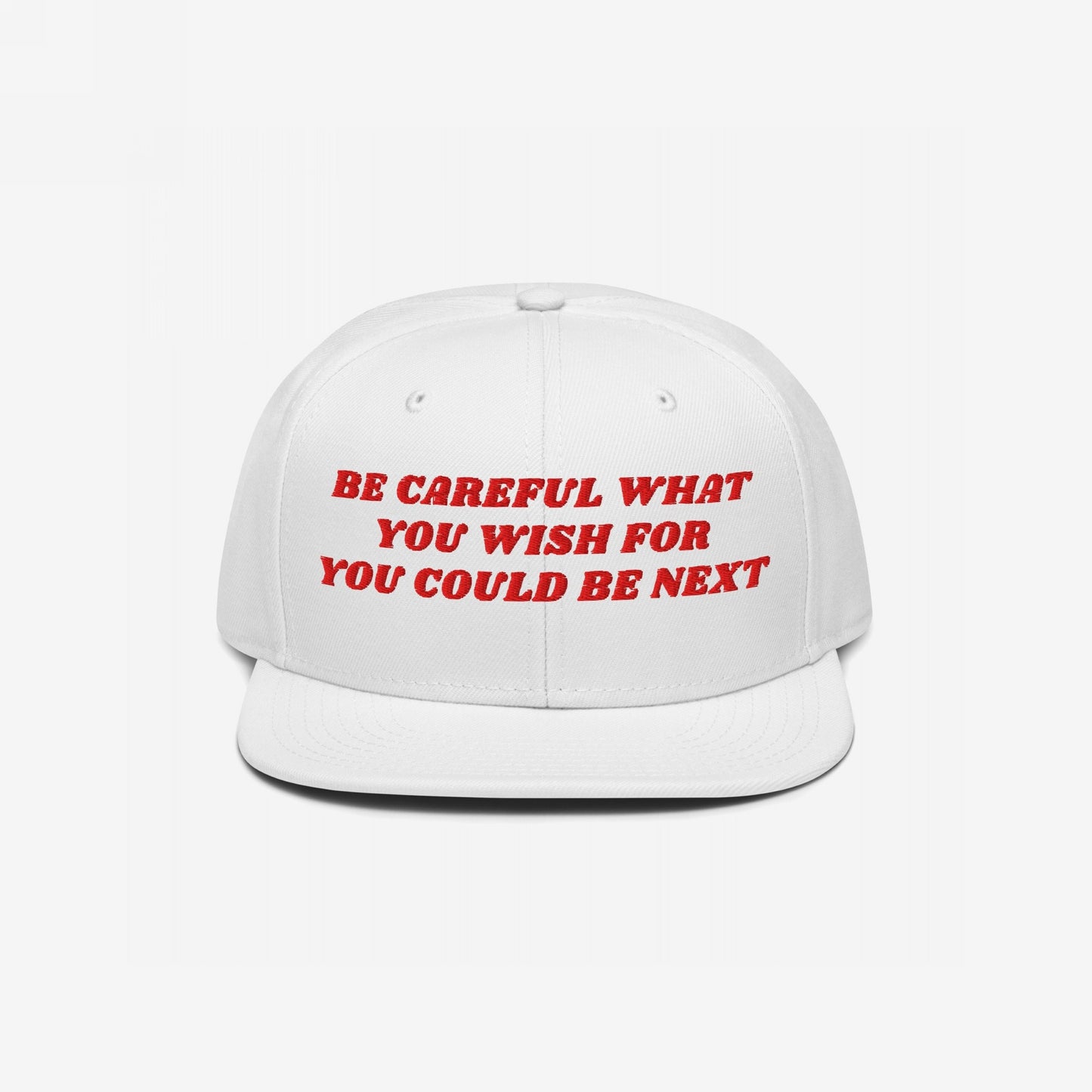 White flat-billed Be Careful Hat with red embroidered warning: “Be Careful What You Wish For, You Could Be Next,” capturing a bold, activist message in sharp, retro style.