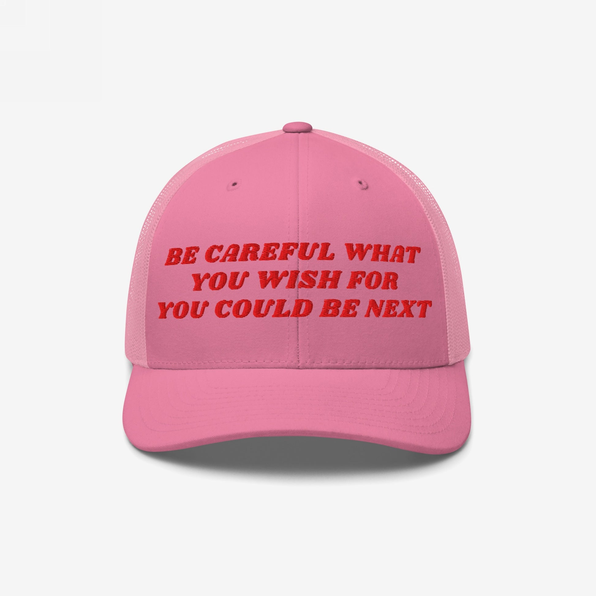 The Be Careful Hat features bold red embroidery on a pink trucker cap, delivering a sharp political message ideal for progressive activists and anti-fascists, supporting justice and equality.