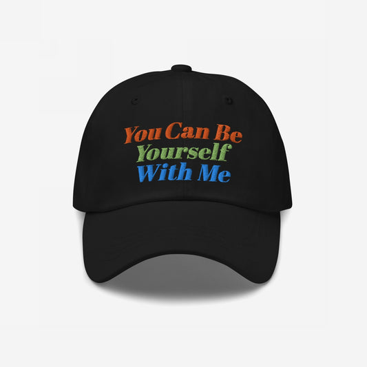 Black Be Yourself Hat featuring a three-color embroidered slogan You Can Be Yourself With Me, symbolizing acceptance and individuality, matching the ethos of inclusivity and equality.
