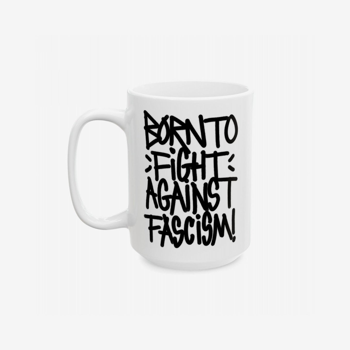 Born To Fight Against Fascism Graffiti Mug: White ceramic mug featuring a bold, black graffiti-style slogan, promoting anti-fascism and resistance, perfect for fueling activism with every sip.