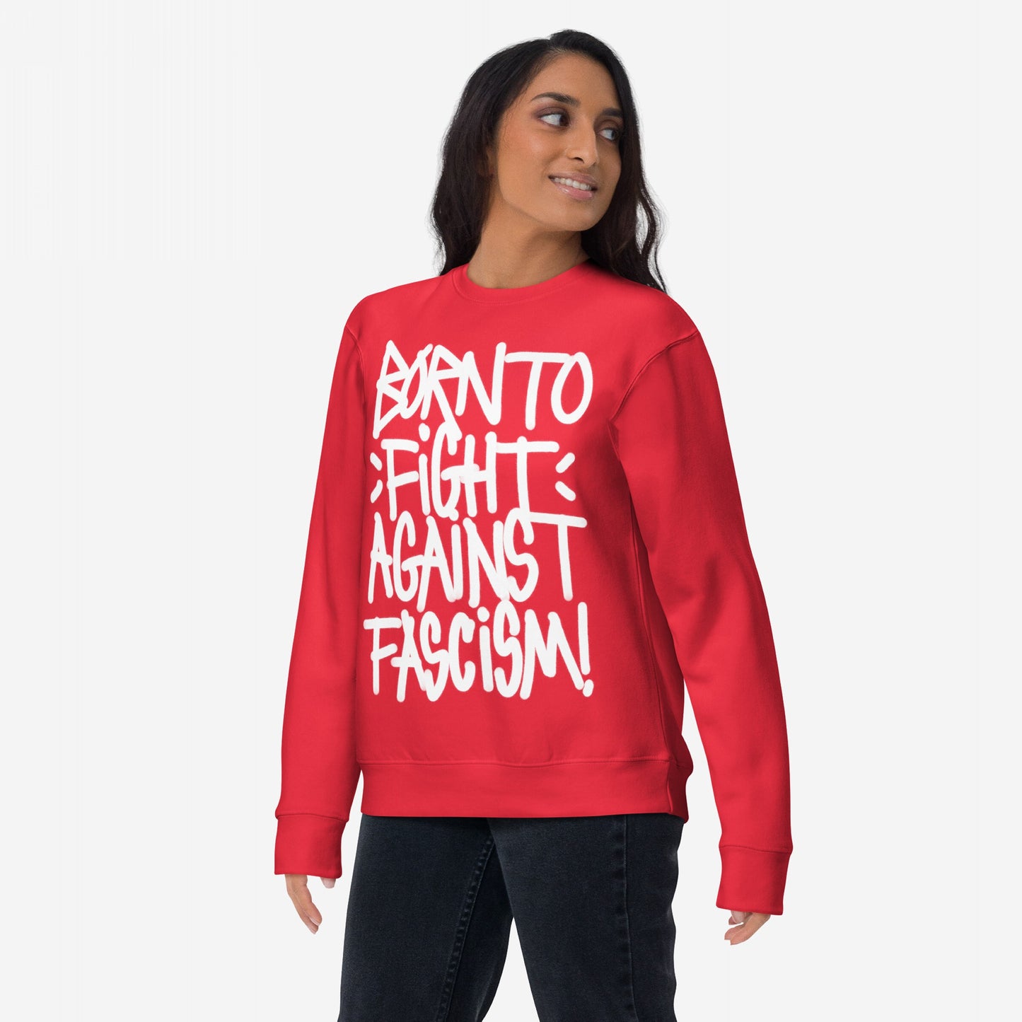 Model wearing Born To Fight Against Fascism Graffiti Hoodie & Sweatshirt with bold, white lettering on a red crewneck. Stands defiantly, embodying resistance and rebellion against oppressive systems.