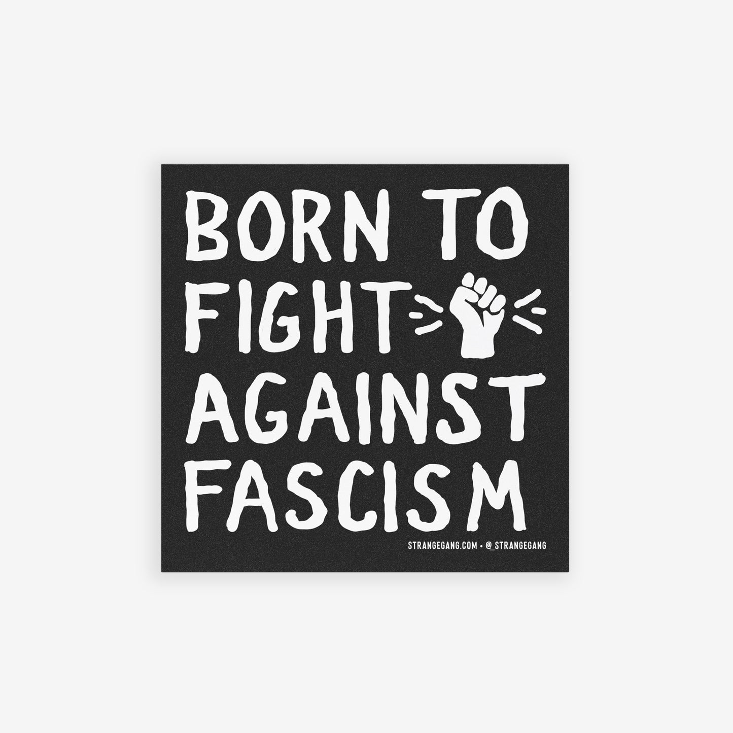 “Born to Fight Against Fascism” sticker and magnet design features bold, hand-drawn lettering with a raised fist icon, set against a blurred crowd scene, offered as either a magnet or sticker.