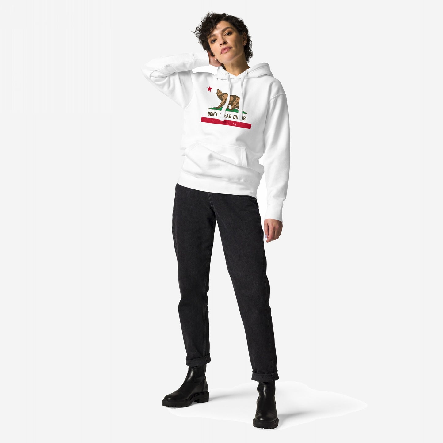 California Gadsden Flag Hoodie features a brown bear graphic with red star, slogan DON'T TREAD ON US, styled with black jeans and boots, embodying anti-authoritarian spirit and West Coast grit.
