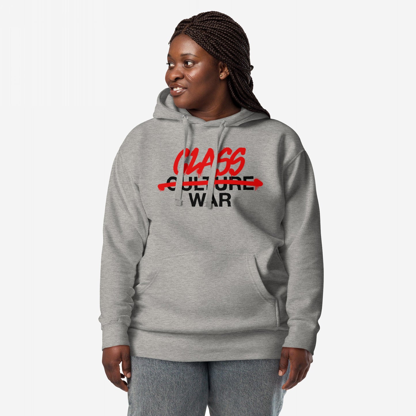 Adult models the Class War Hoodie, featuring CLASS WAR boldly scrawled over CULTURE with a red strike-through, symbolizing confrontation and activism. Includes kangaroo pocket and hood drawstrings.