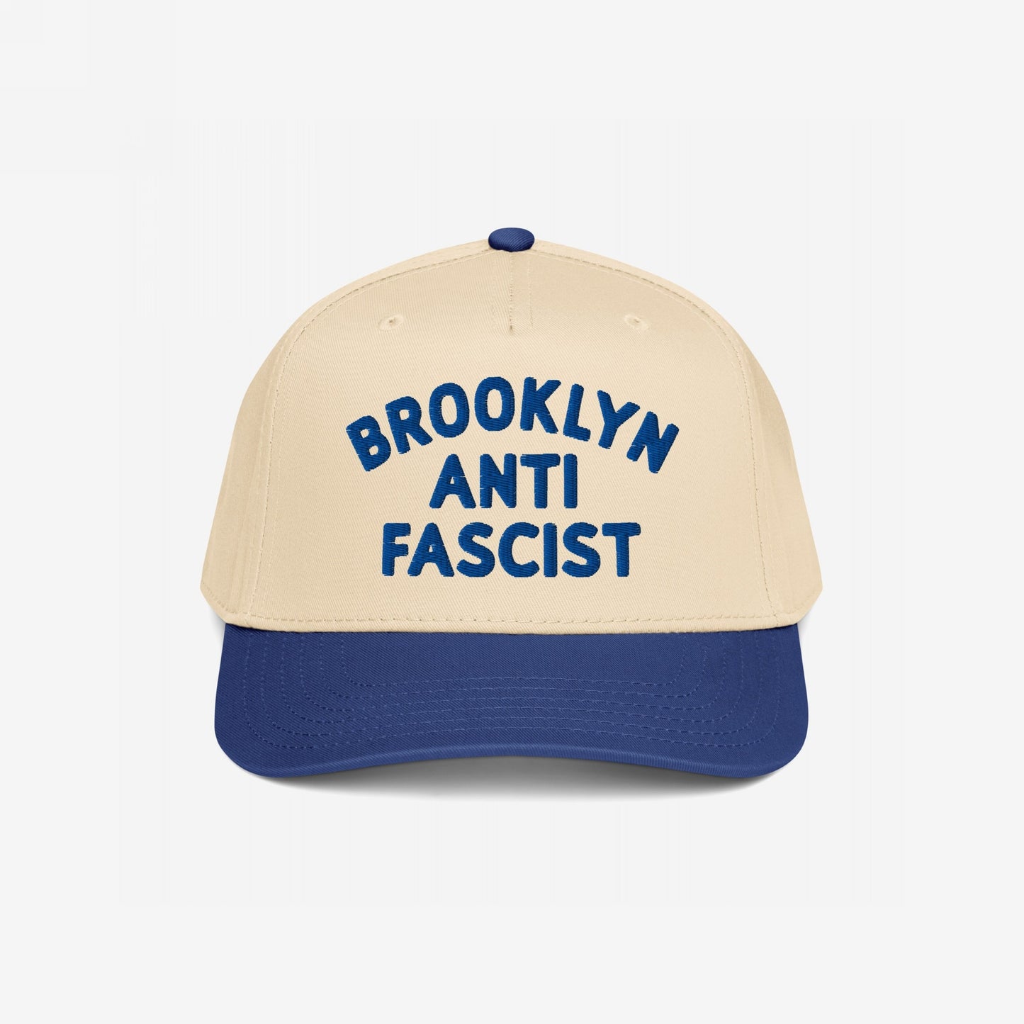 Custom Anti-Fascist 5-Panel Hat with a beige crown and navy brim features bold blue BROOKLYN ANTI FASCIST embroidery, offering a stylish, structured design perfect for activism and personalization.