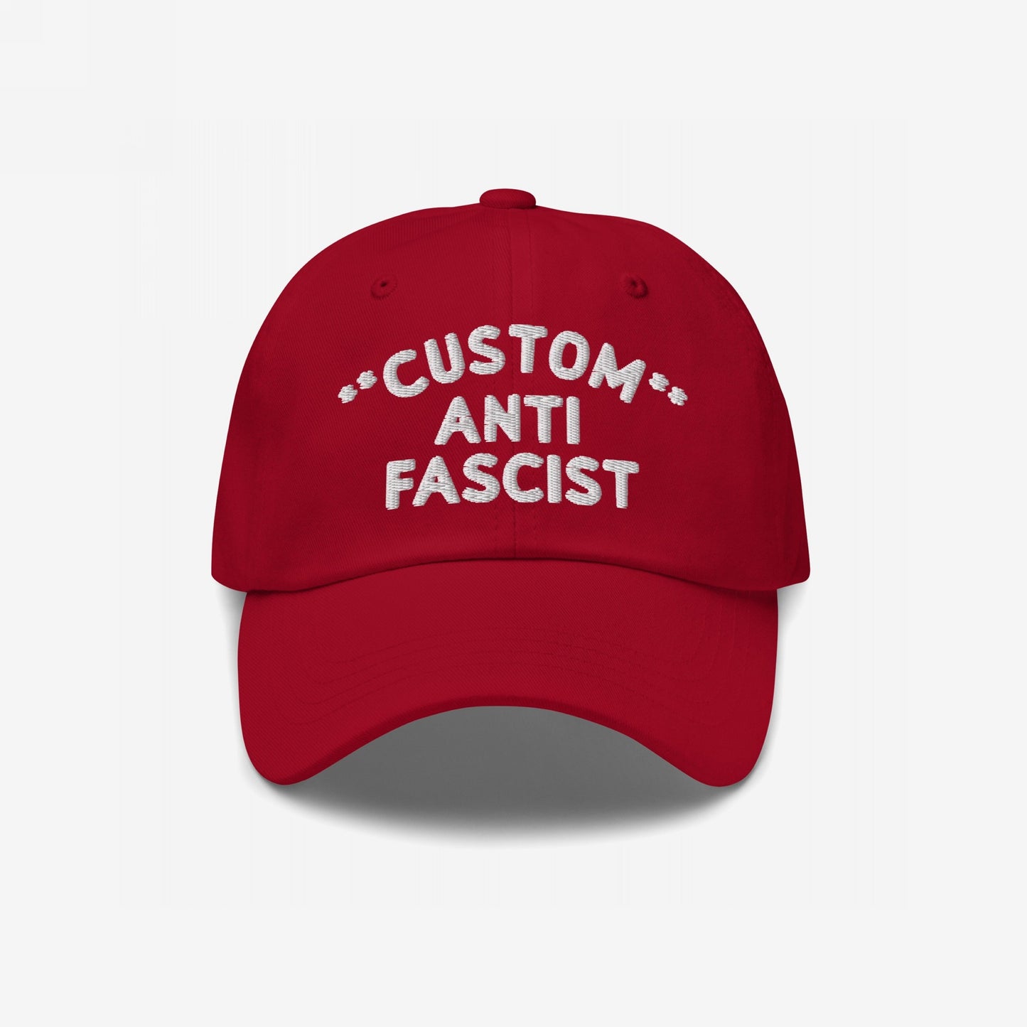 Red Custom Anti-Fascist Dad Hat with white embroidered CUSTOM ANTI FASCIST text, featuring an unstructured, low-profile design and adjustable strap, promoting equality and anti-fascism.