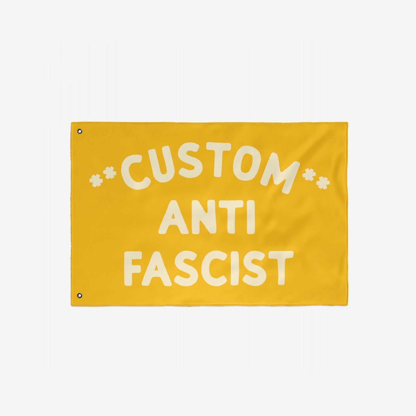 Custom Anti-Fascist Flag featuring bold off-white text on a yellow background, with two metal grommets for hanging. Ideal for promoting unity and resistance at events or home displays.