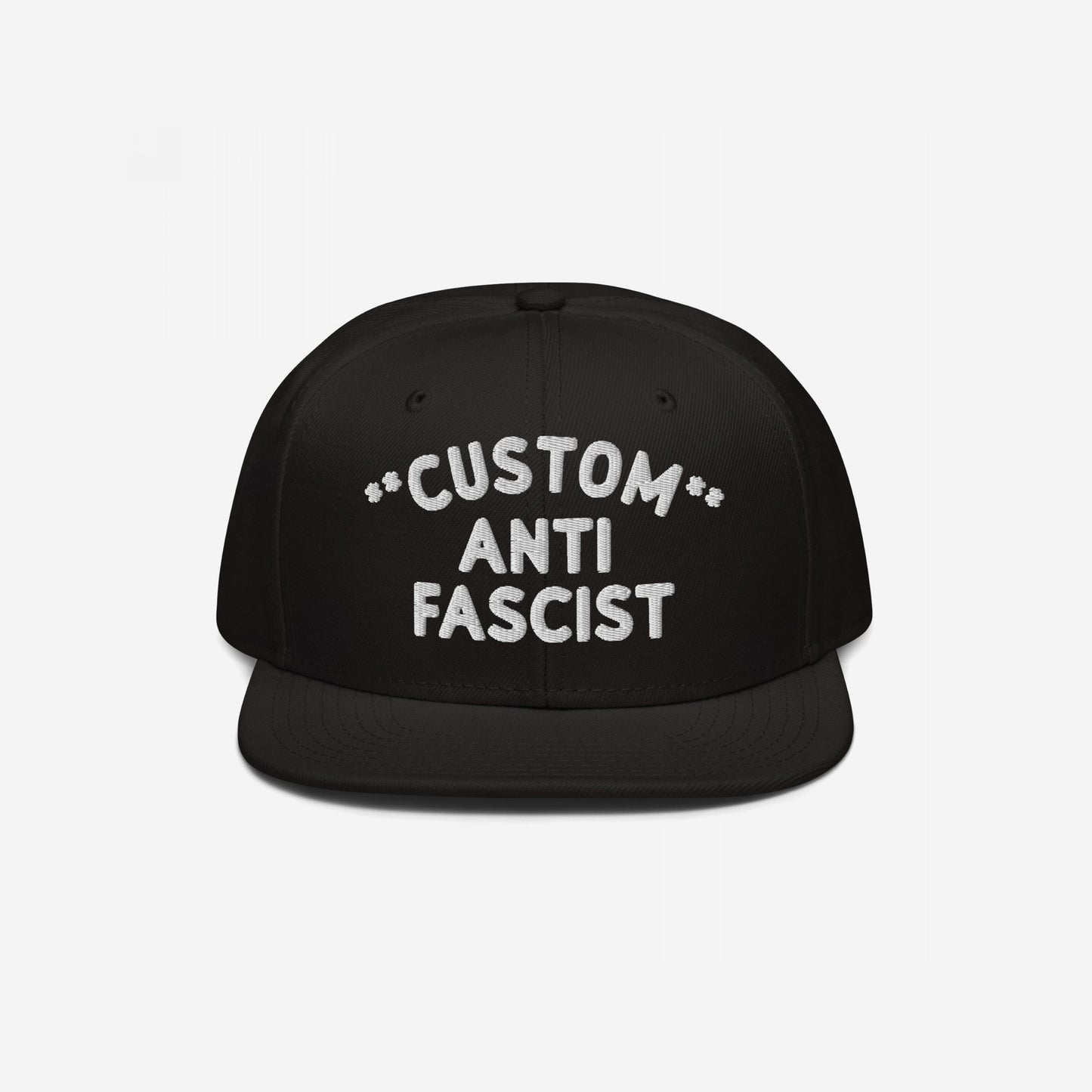 Custom Anti-Fascist Snapback Hat with bold white embroidery on a black flat-brimmed cap, featuring adjustable closure. Personalize the Custom text, showcasing your stance against fascism with style and comfort.