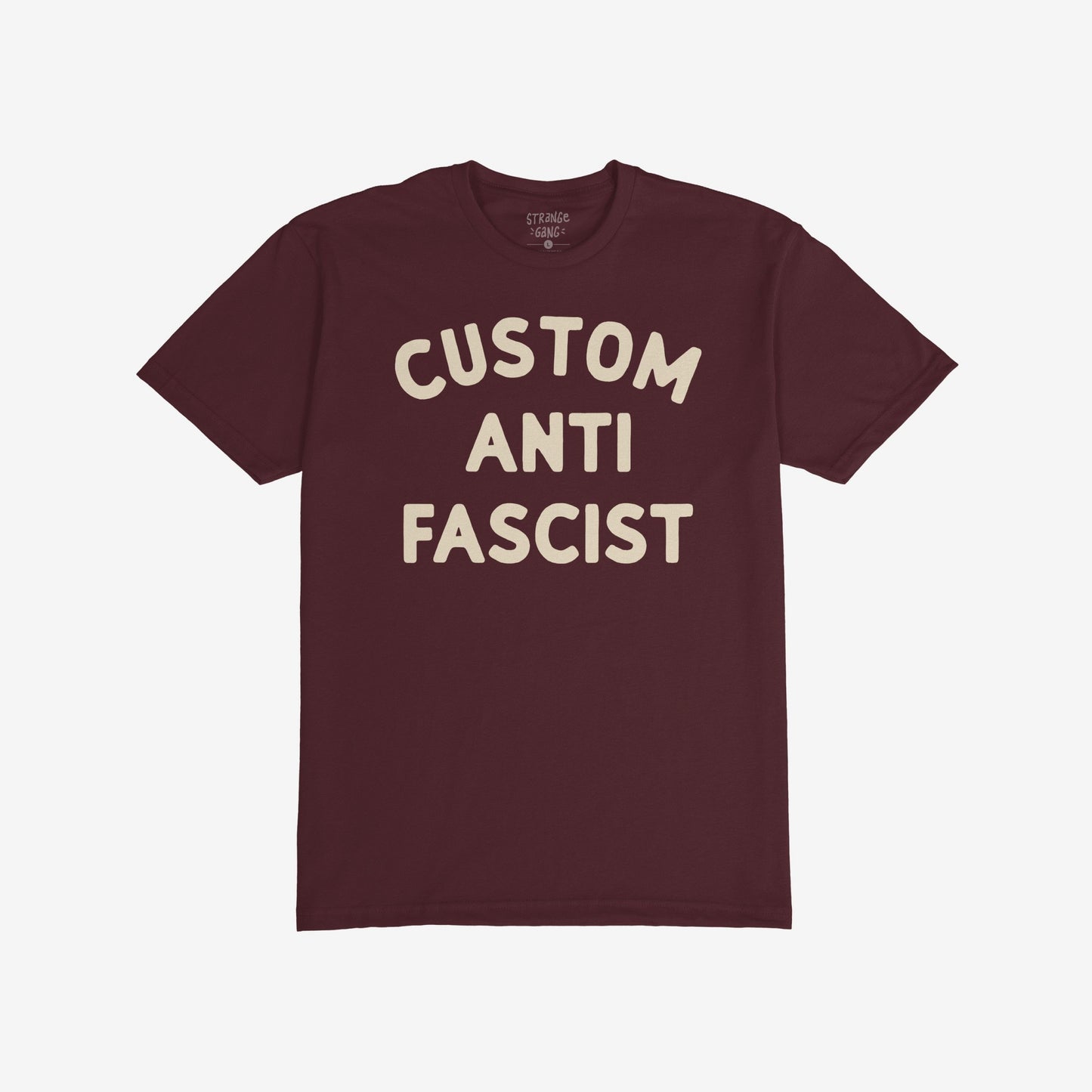 Custom Anti-Fascist T-shirt featuring bold cream text CUSTOM ANTI FASCIST on a maroon crew-neck, embodying a strong anti-fascism message. Ideal for activism and everyday wear.