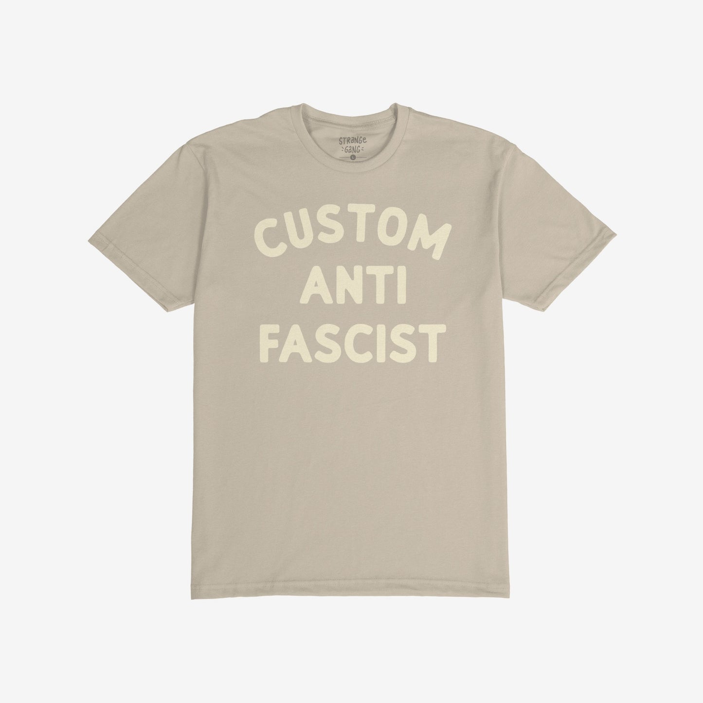 Light tan Custom Anti-Fascist T-shirt with bold off-white block lettering, allowing personalization of the Custom text; perfect for expressing activism and opposing fascism through fashion.
