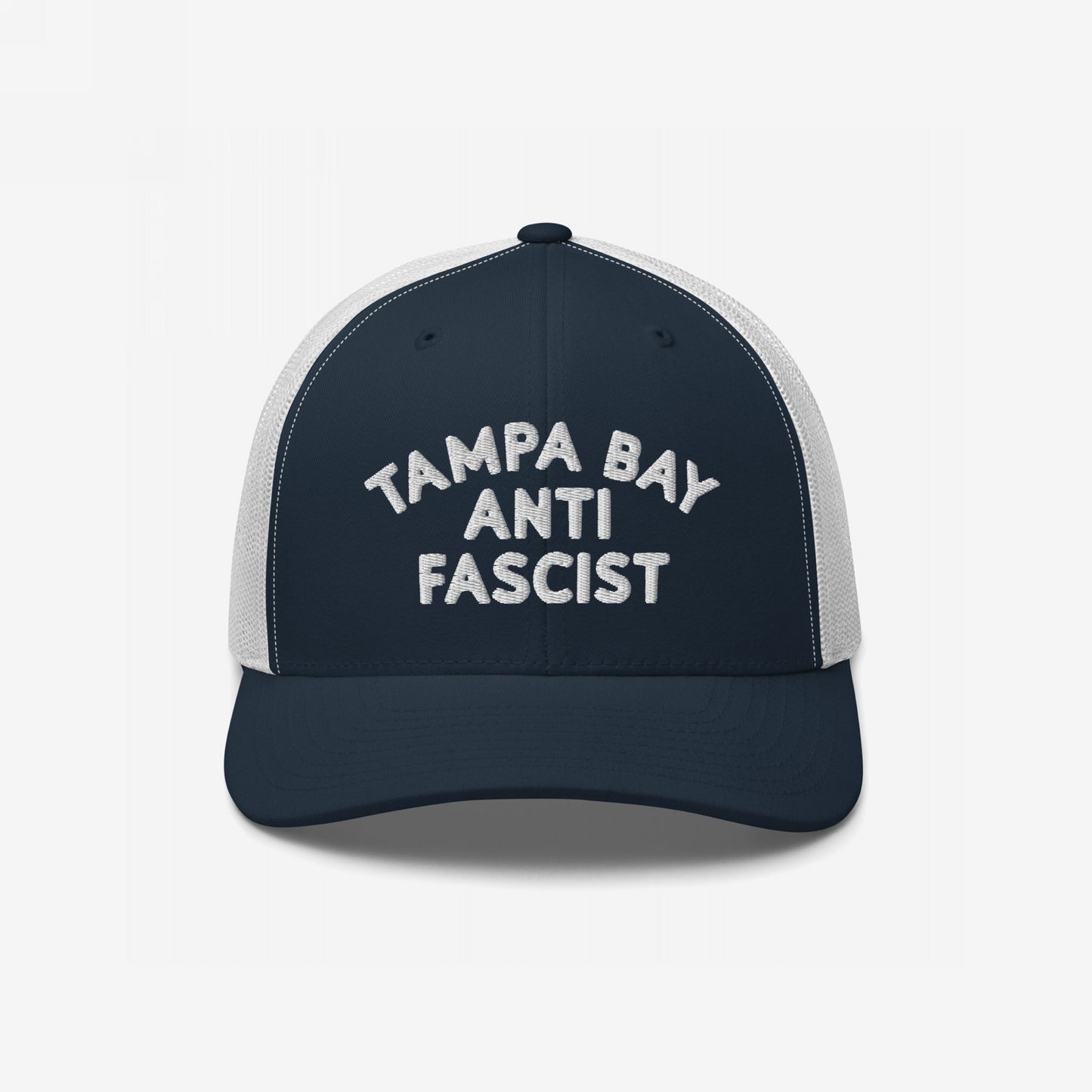 Custom Anti-Fascist Trucker Hat featuring TAMPA BAY ANTI FASCIST embroidered on a navy front with a white mesh back and adjustable snap closure, combining bold style with breathable comfort.