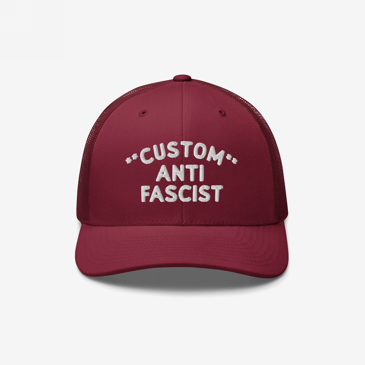 Burgundy mesh-back trucker hat with CUSTOM ANTI FASCIST white embroidery on the front. Features breathable mesh, adjustable snap closure, and customizable text, embodying a bold anti-fascist message.