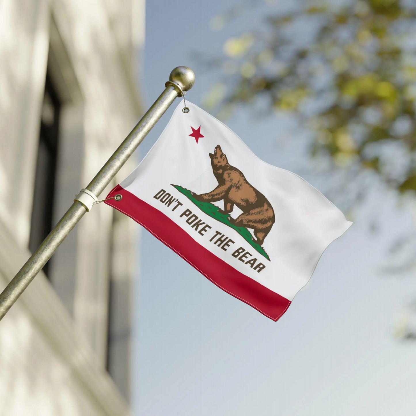 California protest flag waving outdoors, Don’t Poke The Bear design in motion as a statement of resistance