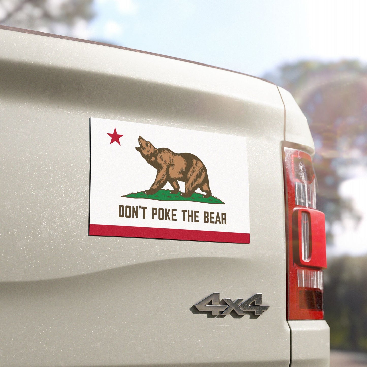 Zoomed-in view of California protest magnet with bear design on truck, detailed anti-authoritarian graphic