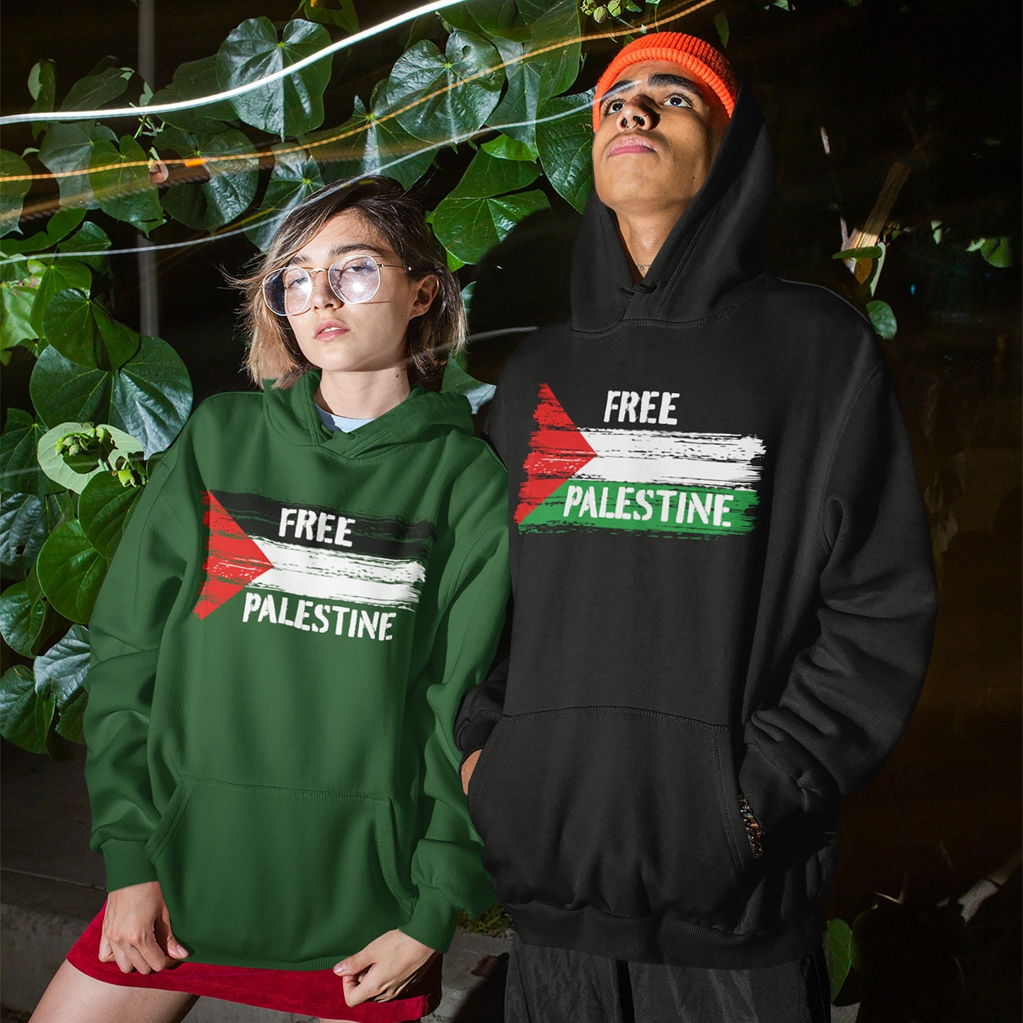 Young adults wear the Free Palestine Hoodie & Sweatshirt featuring a distressed flag graphic, symbolizing solidarity and activism, amidst streaks of light, embodying resistance and liberation.