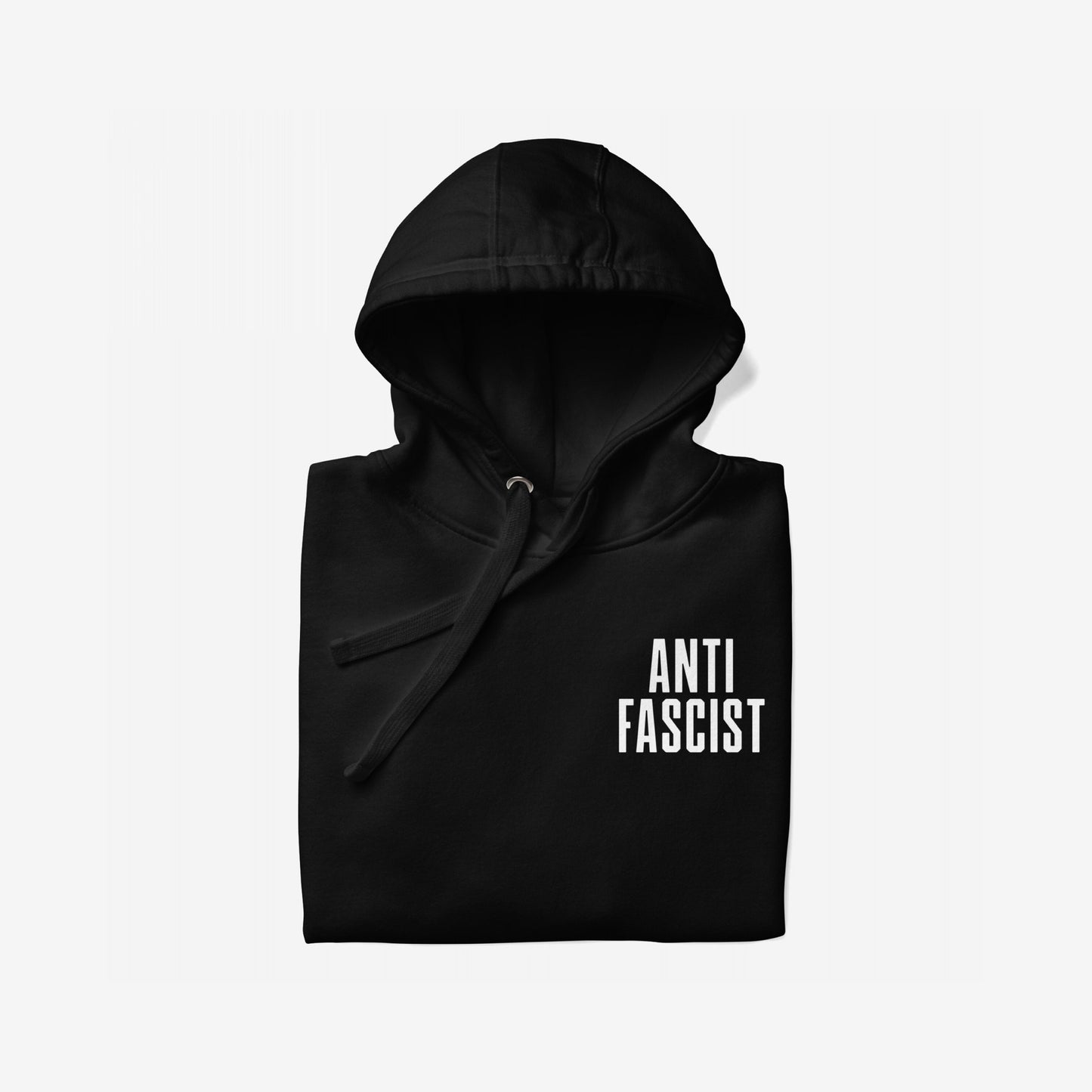 Fuck 'Em All Back Print Hoodie features ANTI FASCIST in bold white letters on the front. The hooded sweatshirt is folded neatly, emphasizing its bold statement and protest spirit.