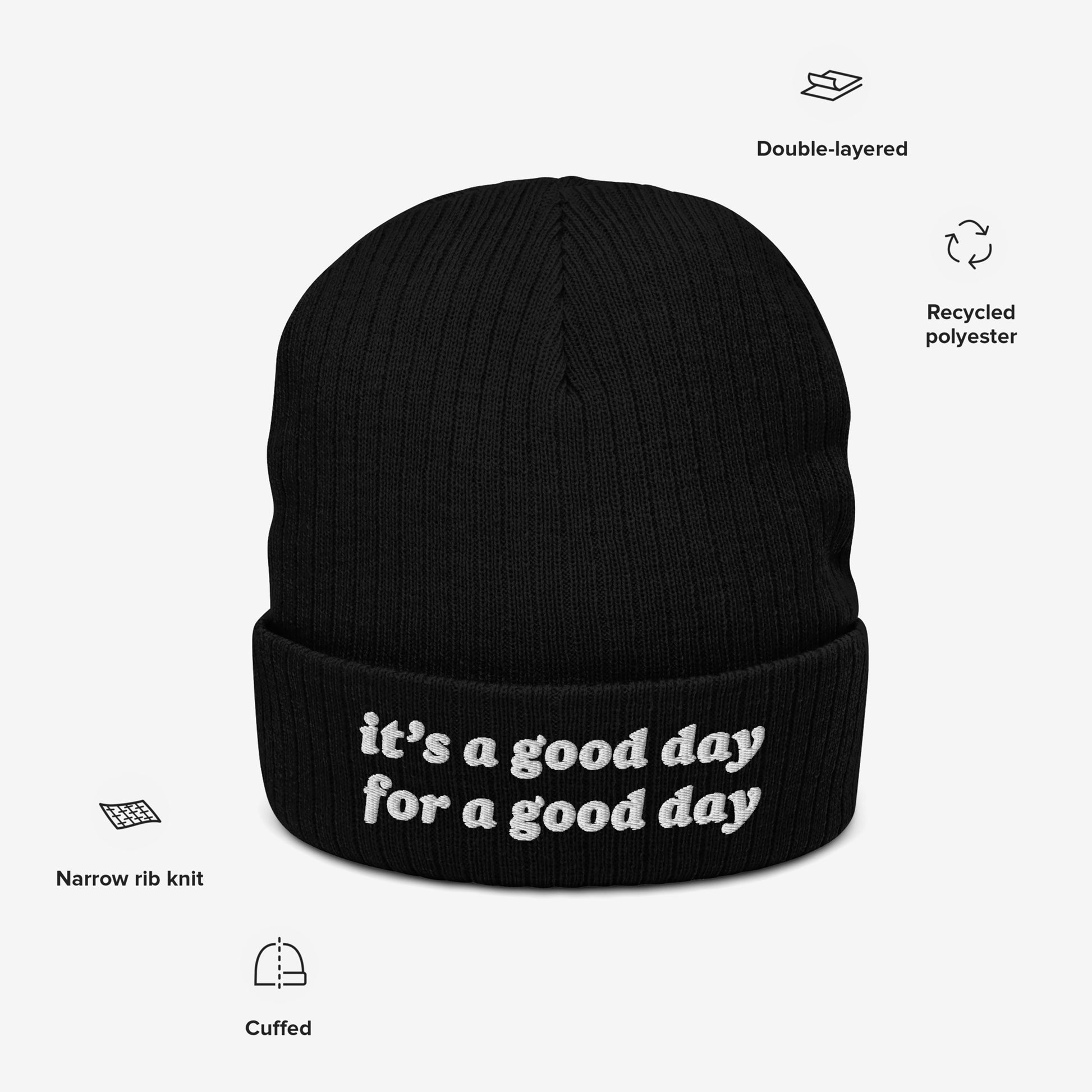 The Good Day Hat is a black, cuffed knit beanie with white embroidered text, it's a good day for a good day, featuring a narrow rib knit design made from recycled polyester.