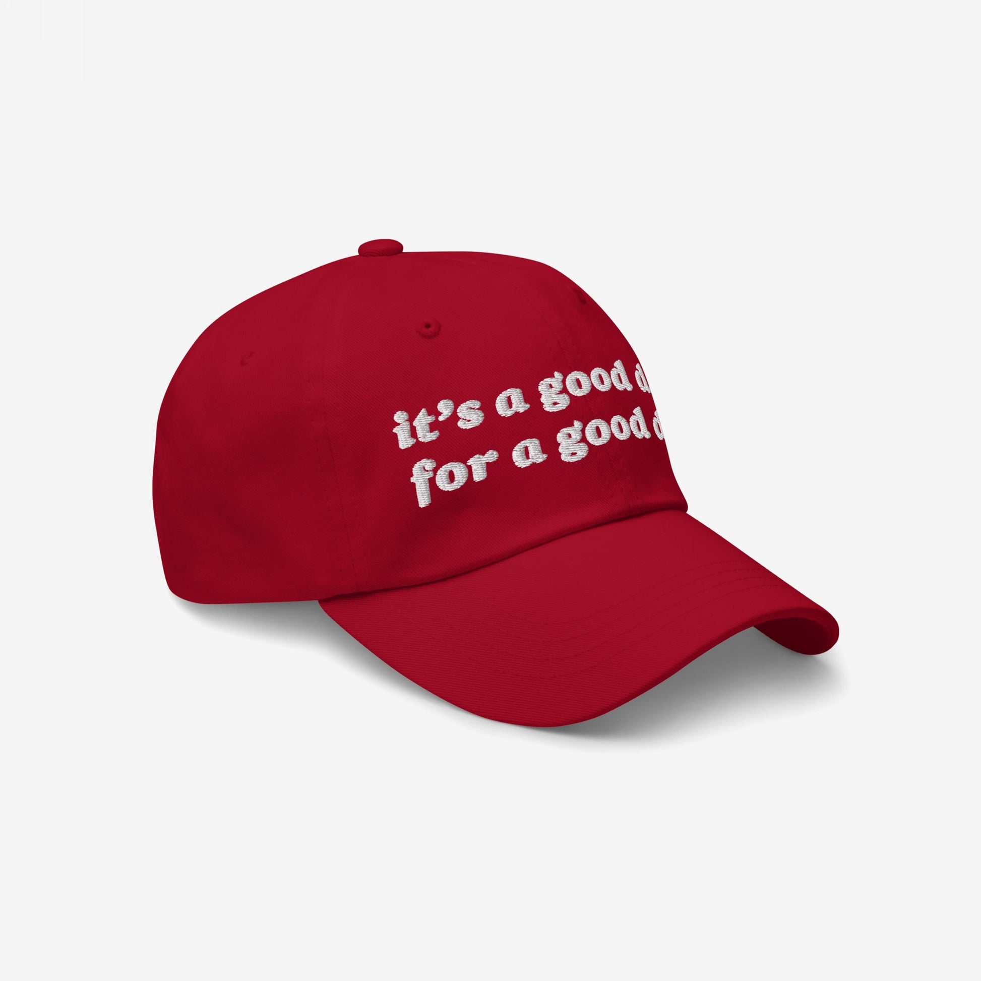 Red, curved-bill Good Day Hat with white embroidered text, it's a good day for a good day, promoting mental health positivity and kindness. Ideal for advocates of equality and uplifting spirits.