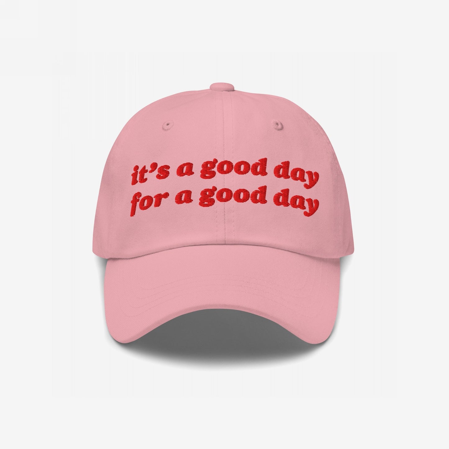 Good Day Hat with playful red embroidery stating “it’s a good day for a good day,” embodying positivity and retro style, perfect for advocates of optimism and equality.