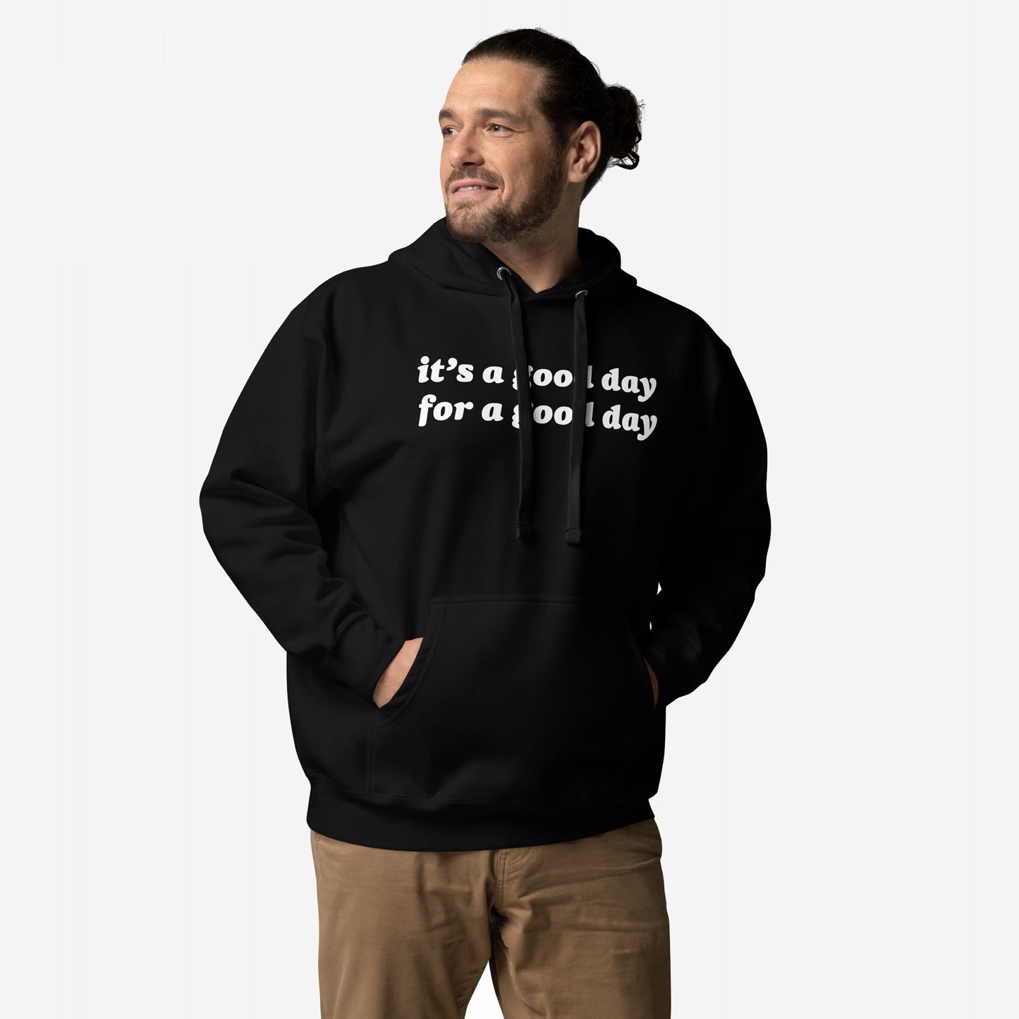 Person wearing the Good Day Hoodie & Sweatshirt, featuring it’s a good day for a good day text. The black pullover has a kangaroo pocket, paired with tan pants, embodying optimism and comfort.