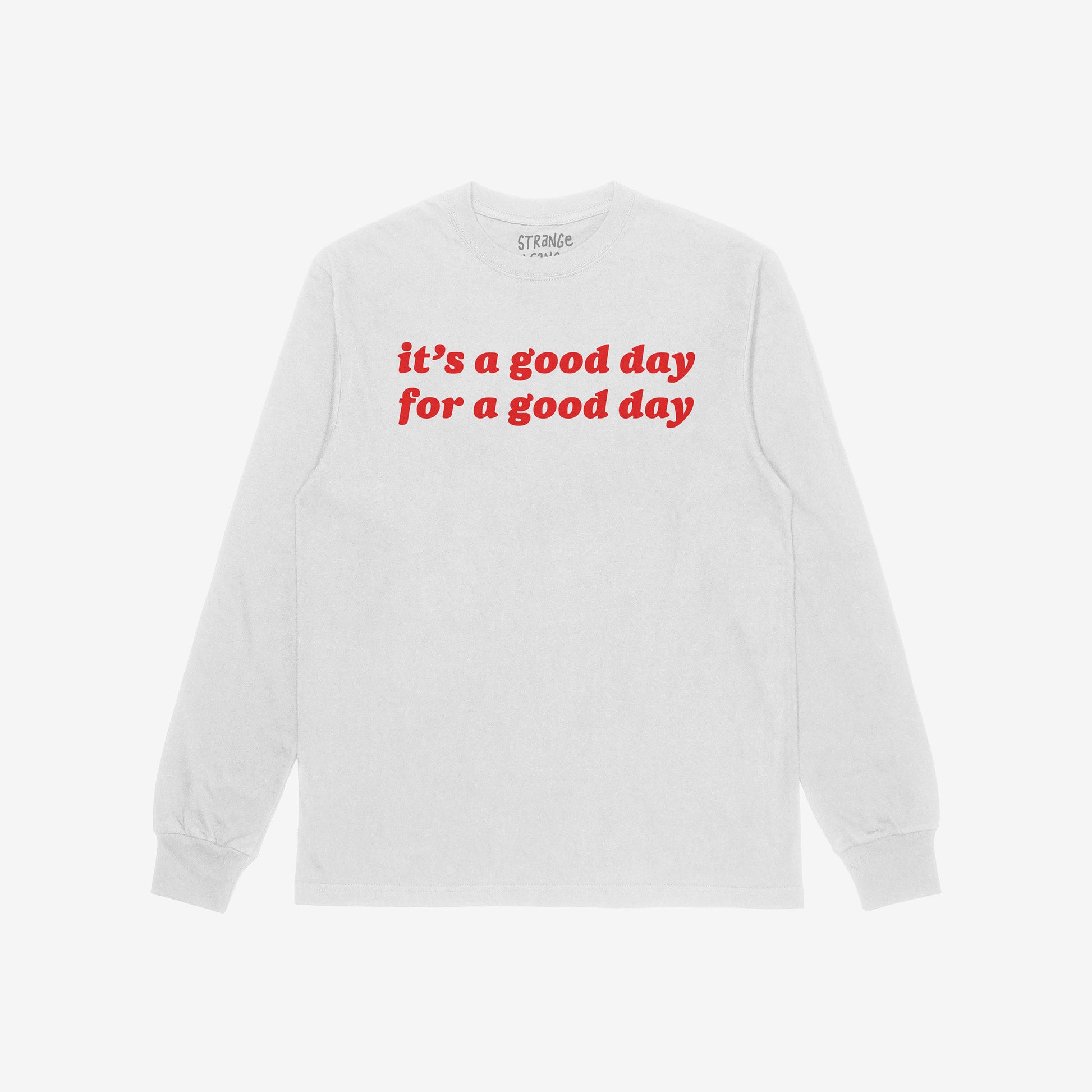 Good Day Shirt featuring bold red text “it’s a good day for a good day” on a white long-sleeve, embodying positivity and vintage vibes, laid flat against a white backdrop.