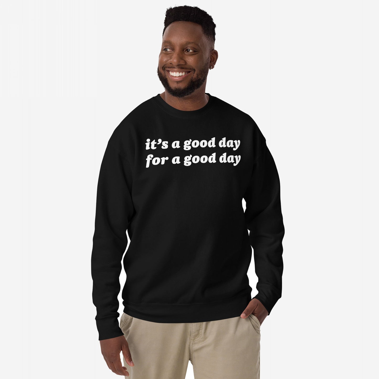 Man wearing the Good Day Hoodie & Sweatshirt, featuring uplifting it’s a good day for a good day text. The black crewneck embodies positivity and style, ideal for spreading optimism and encouraging a positive mindset.