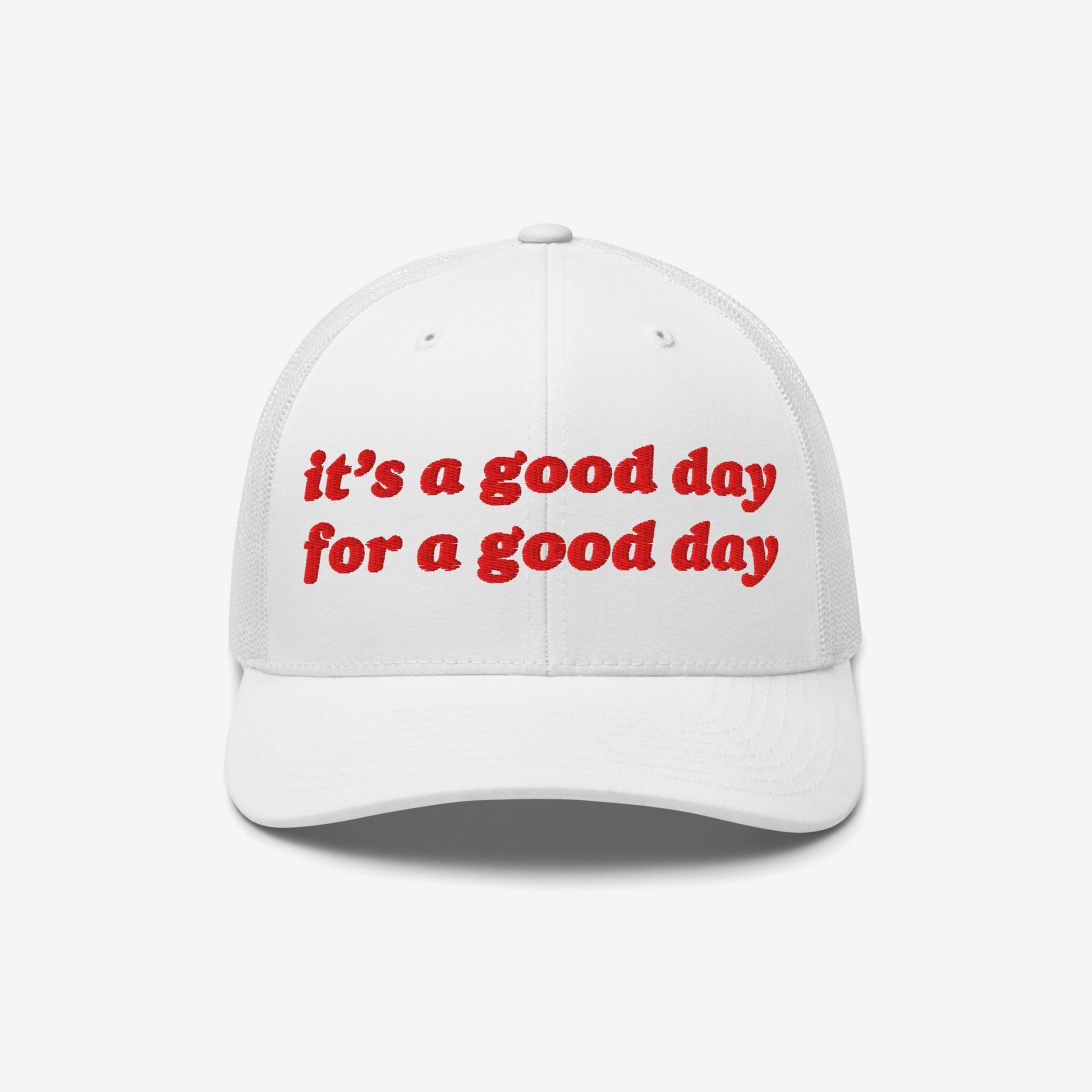 Good Day Hat: A white trucker-style cap with red embroidered text, it’s a good day for a good day, mesh back, and curved brim, promoting positivity and mental health awareness.