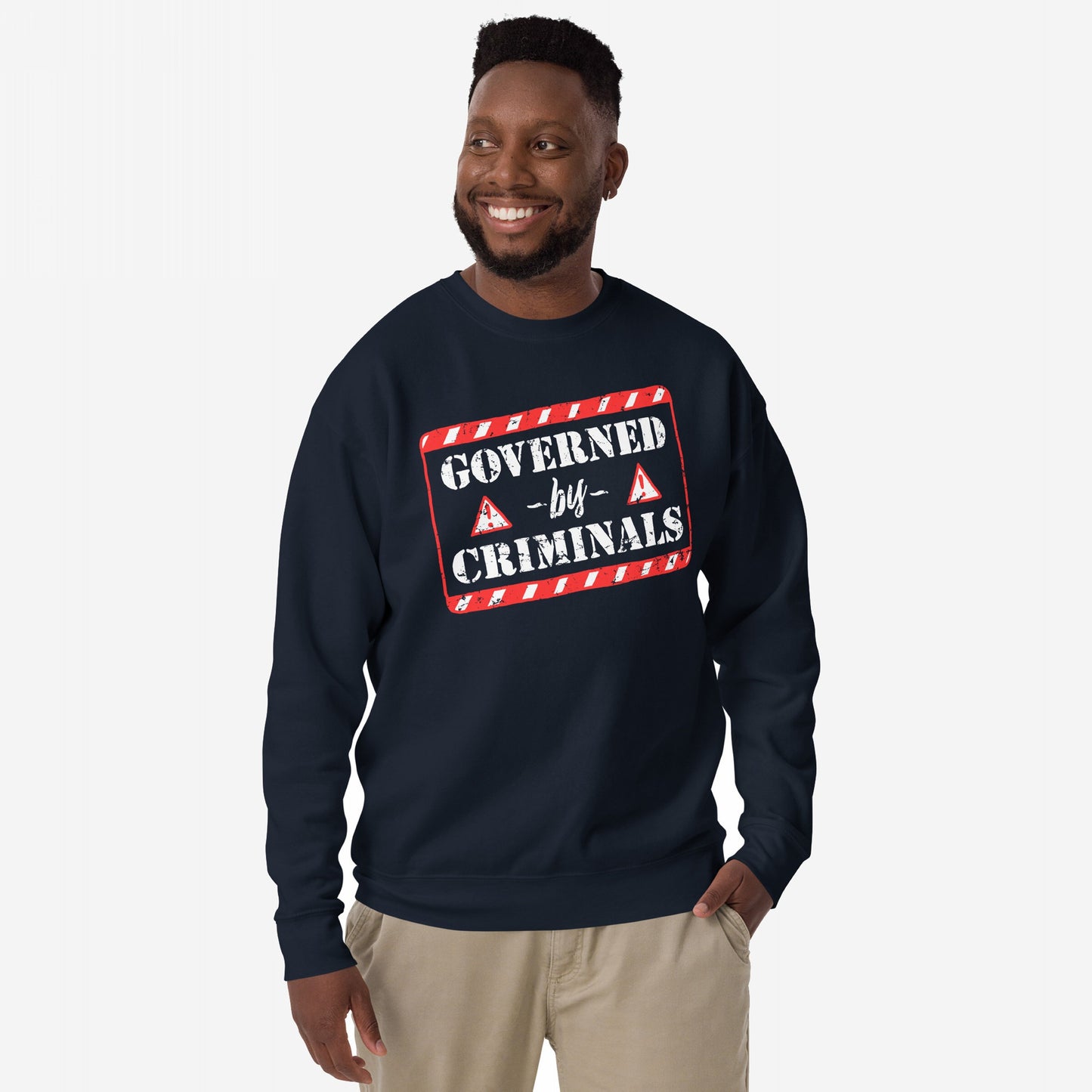 Man in a navy sweatshirt with GOVERNED by CRIMINALS graphic, embodying protest against corruption. Part of the Governed By Criminals Hoodie & Sweatshirt line, ideal for those questioning authority.