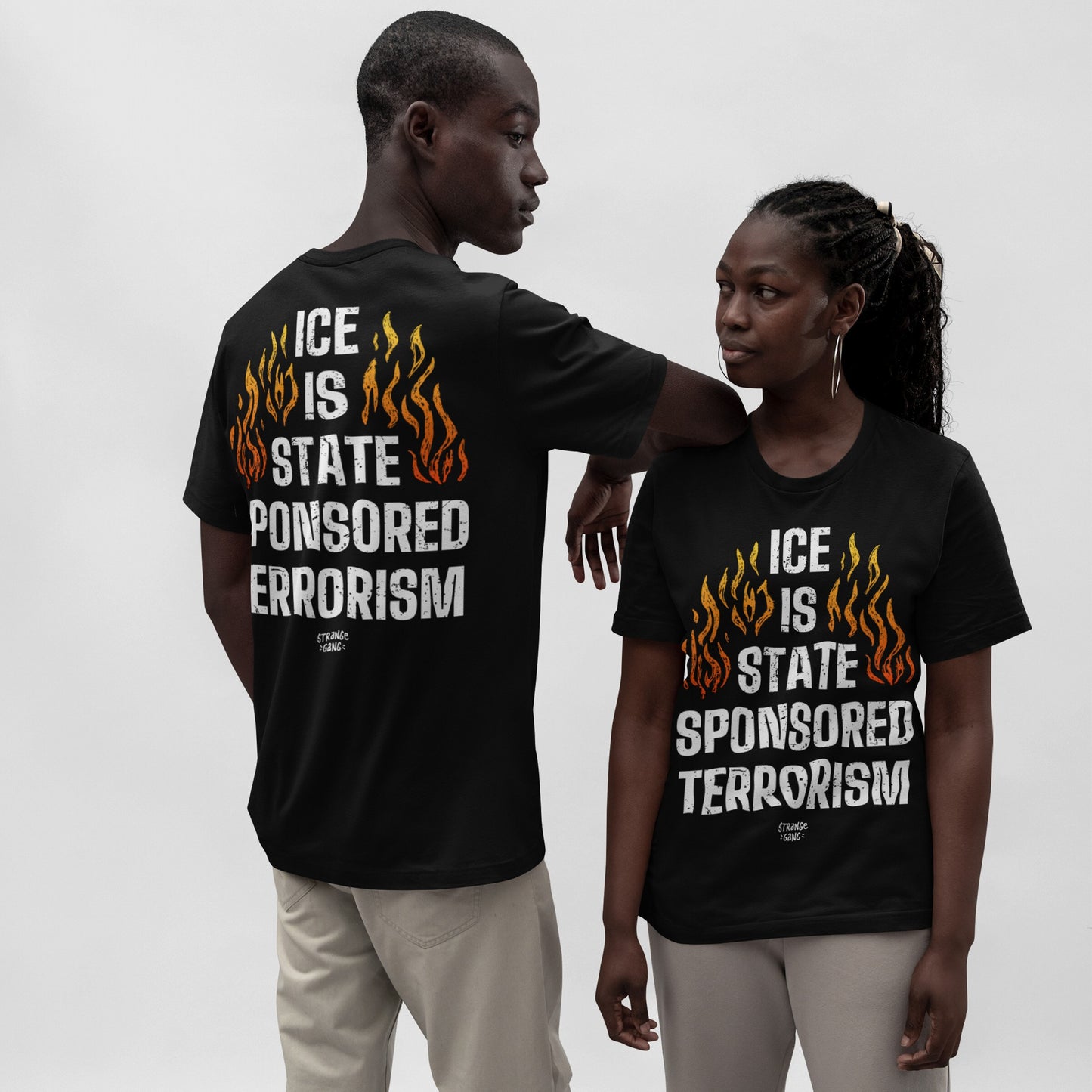 Models wear the ICE Is State Sponsored Terrorism T-shirt, featuring bold text and stylized flames, front and back. This statement piece demands attention and supports immigrant justice.