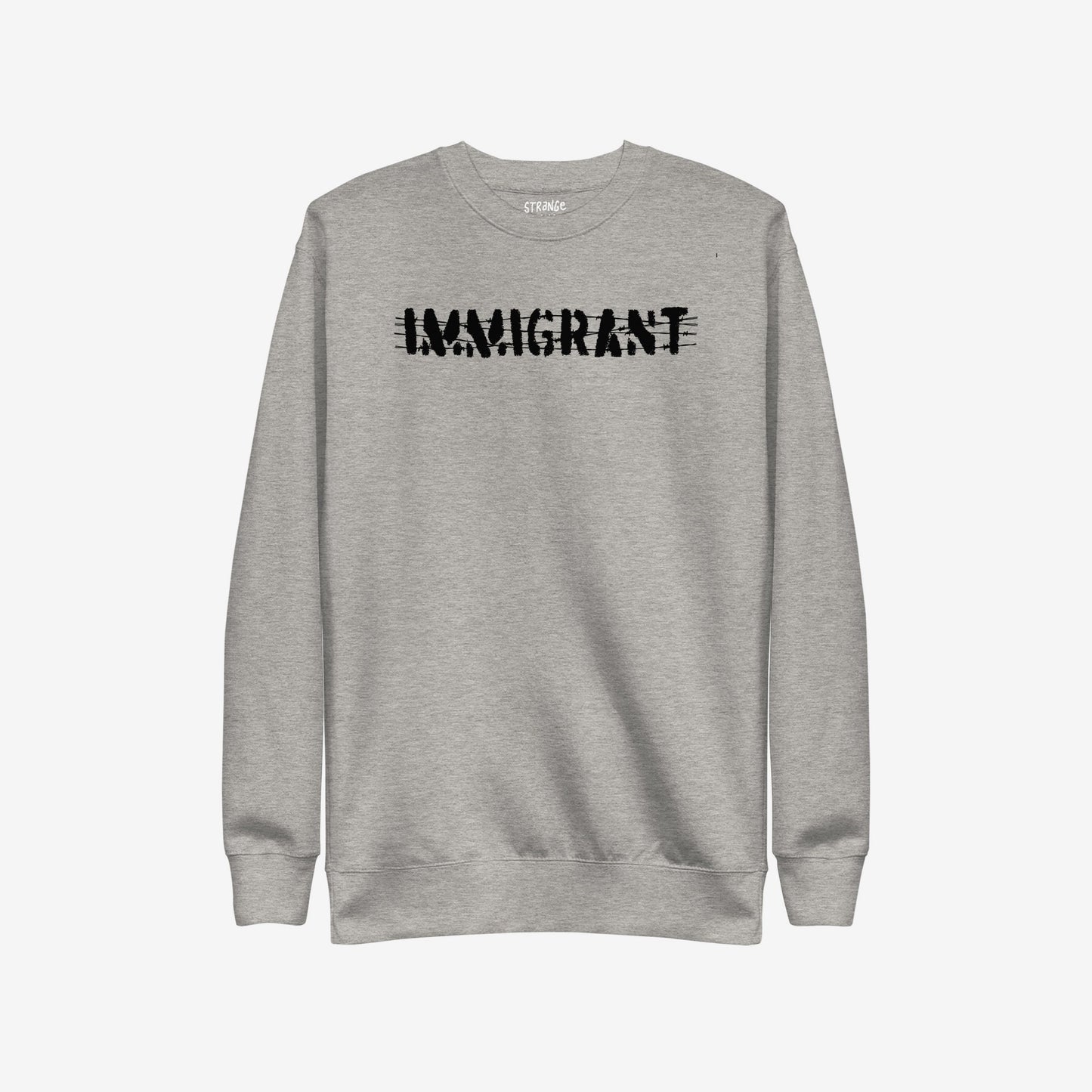 Light-grey Immigrant Hoodie & Sweatshirt features bold, distressed IMMIGRANT lettering with slash-through style, embodying activism and solidarity. Small label on neckline enhances its statement-making design. Unisex fit encourages unity.