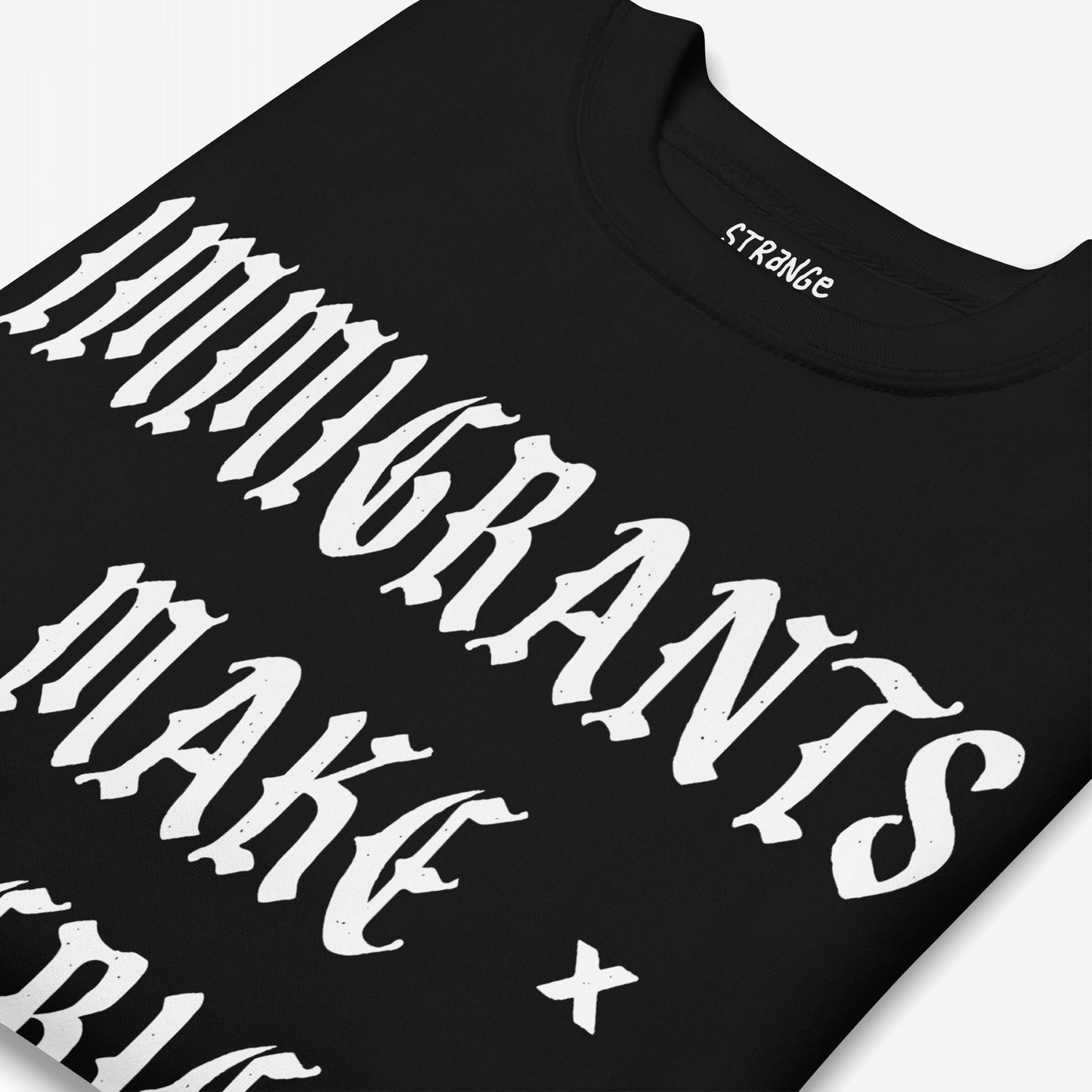 Black T-shirt featuring gothic-style white text STRANGERS make + on the front, highlighting the Immigrants Make America Great Sweatshirt's bold message of immigrant pride and protest.