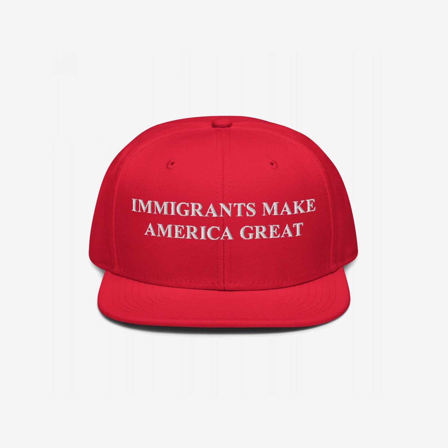 Immigrants Make America Great Hat: Red, flat-brim baseball cap with bold white embroidery, symbolizing support for immigrant rights and equality. Ideal for rallies or daily wear, supporting Amnesty International.